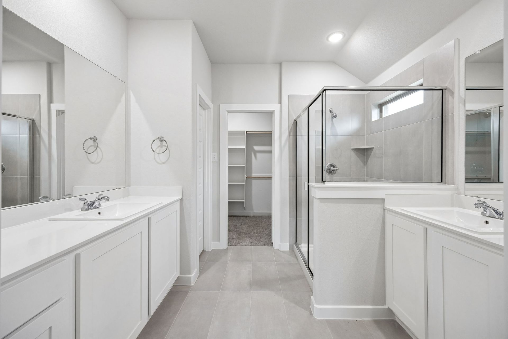 Primary Bathroom in the Heisman home plan by Trophy Signature Homes - REPRESENTATIVE PHOTO