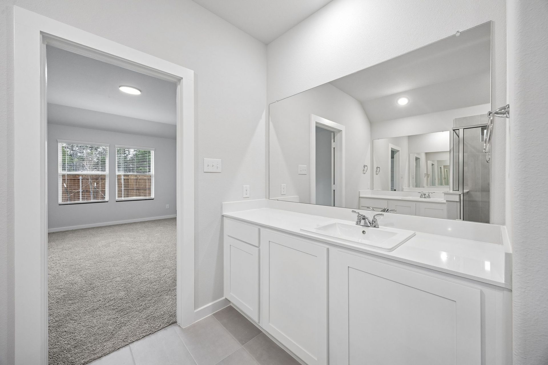 Primary Bathroom in the Heisman home plan by Trophy Signature Homes - REPRESENTATIVE PHOTO