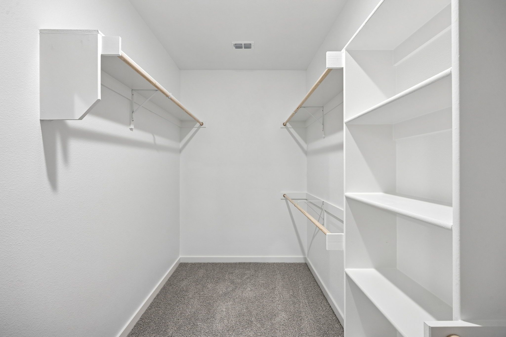 Primary Closet in the Heisman home plan by Trophy Signature Homes - REPRESENTATIVE PHOTO