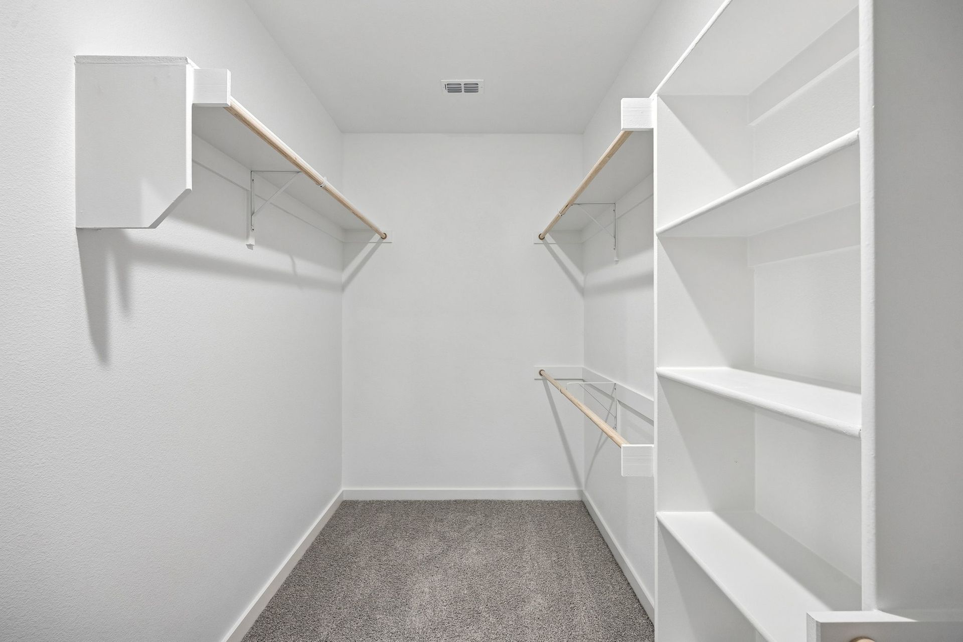 Primary Closet in the Heisman home plan by Trophy Signature Homes - REPRESENTATIVE PHOTO
