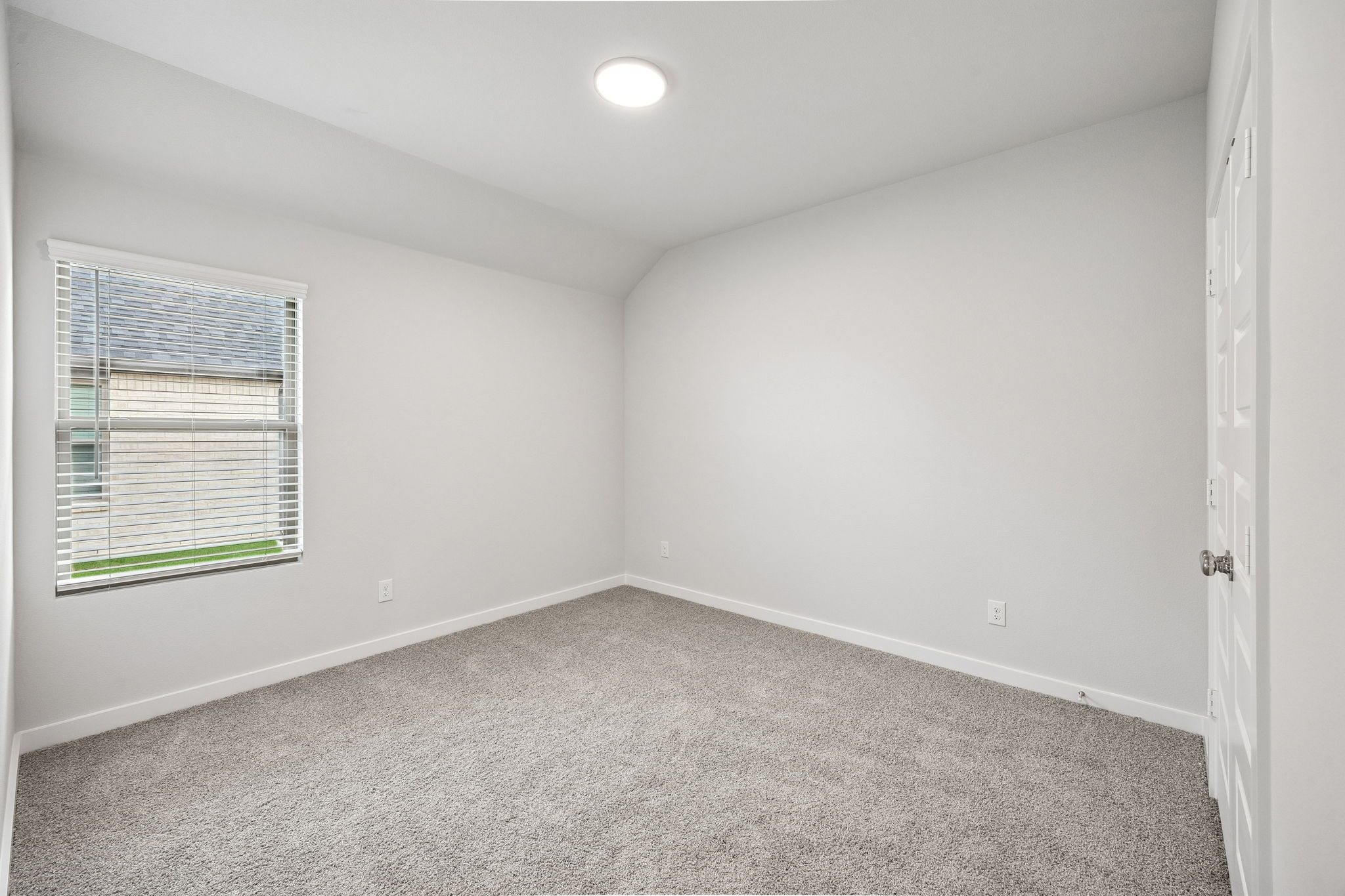 Bedroom in the Heisman home plan by Trophy Signature Homes - REPRESENTATIVE PHOTO