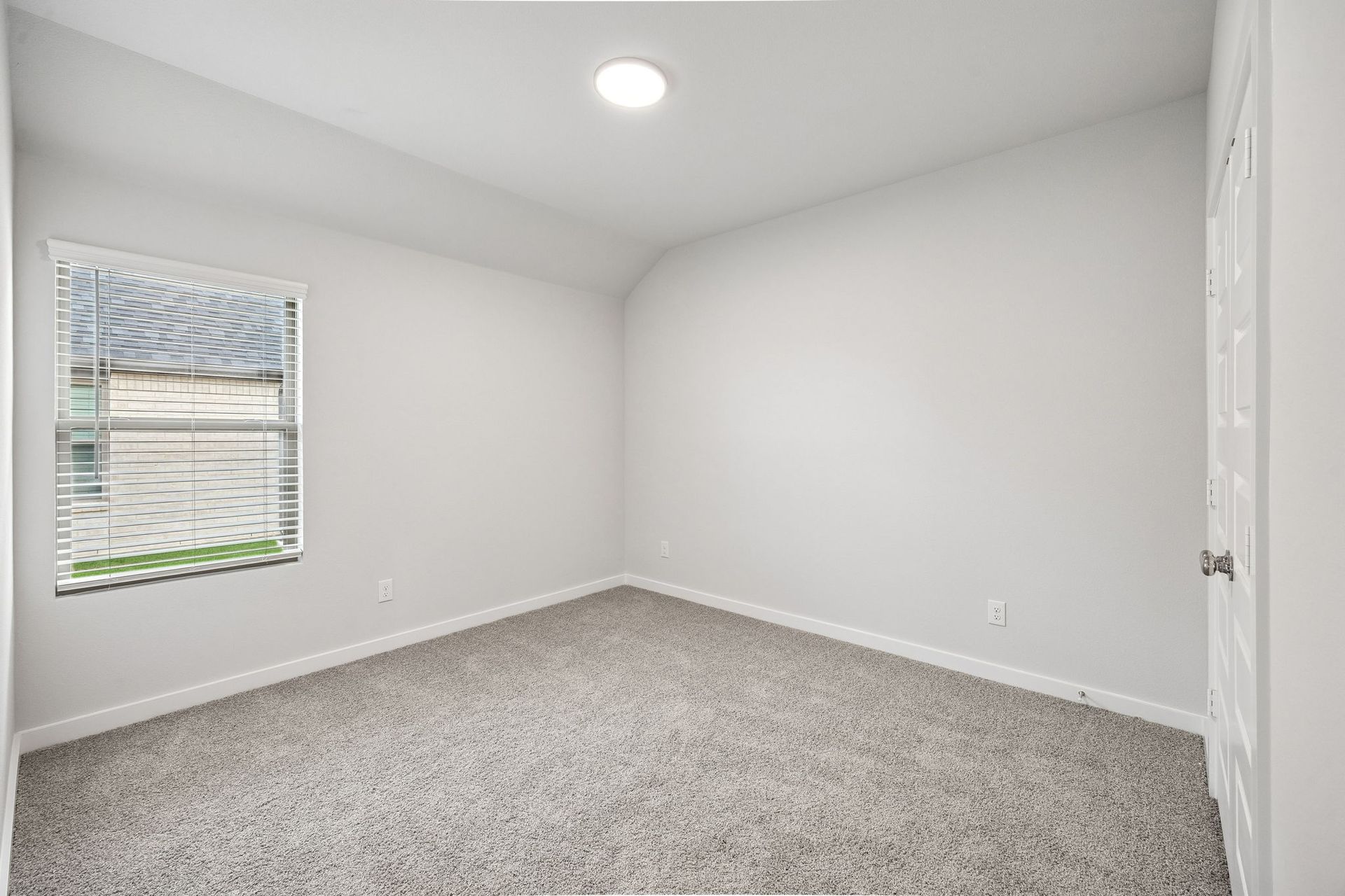Bedroom in the Heisman home plan by Trophy Signature Homes - REPRESENTATIVE PHOTO