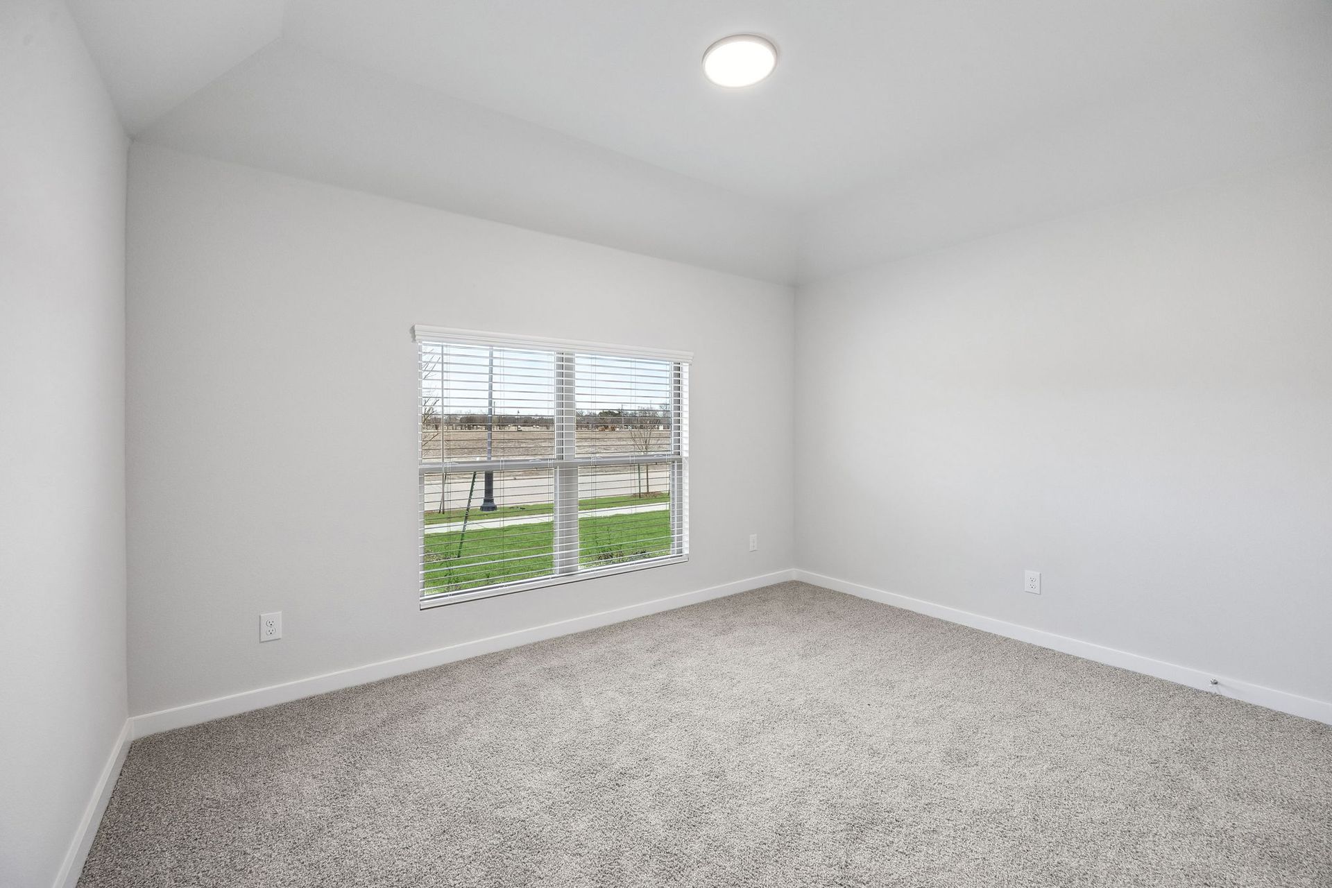 Bedroom in the Heisman home plan by Trophy Signature Homes - REPRESENTATIVE PHOTO
