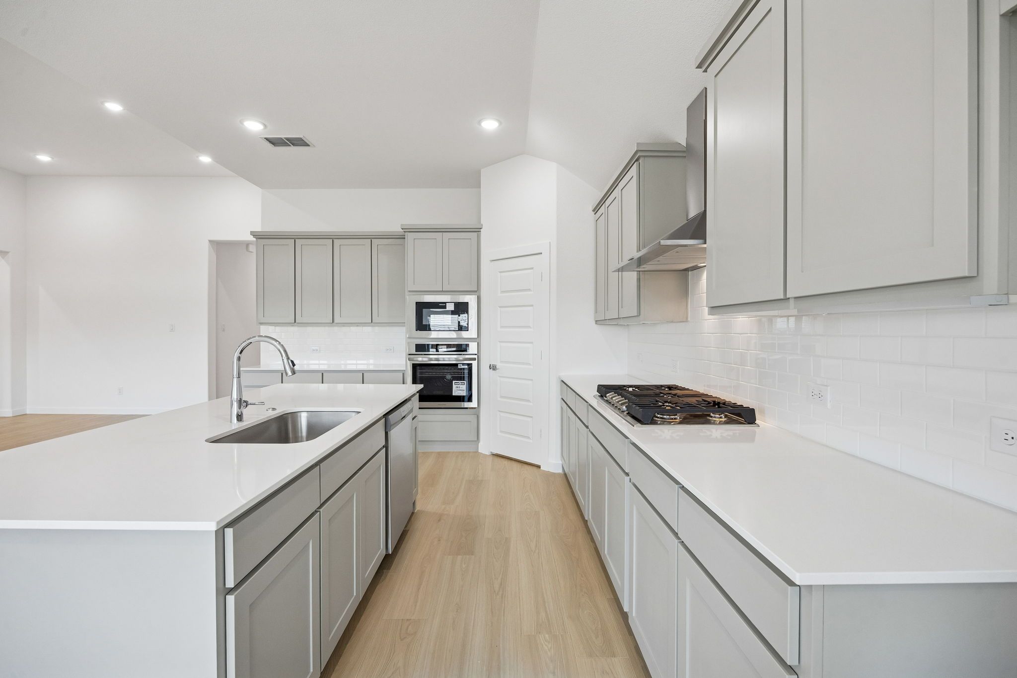 Kitchen in the Gilmour II home plan by Trophy Signature Homes – REPRESENTATIVE PHOTO