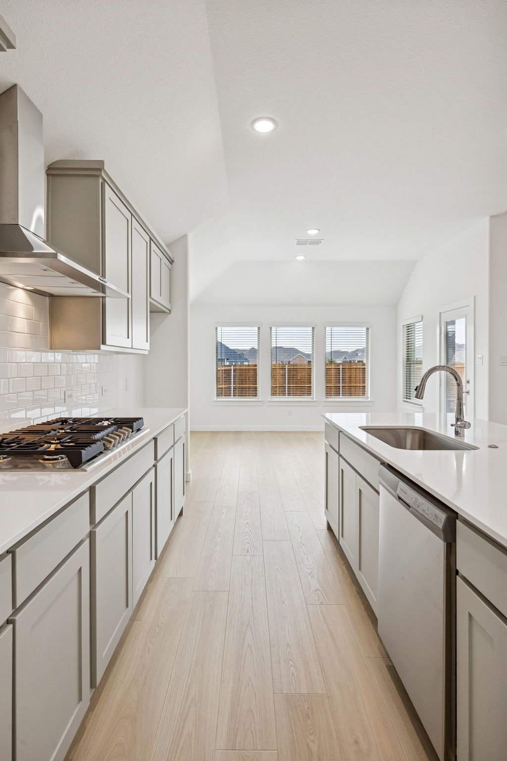 Kitchen in the Gilmour II home plan by Trophy Signature Homes – REPRESENTATIVE PHOTO