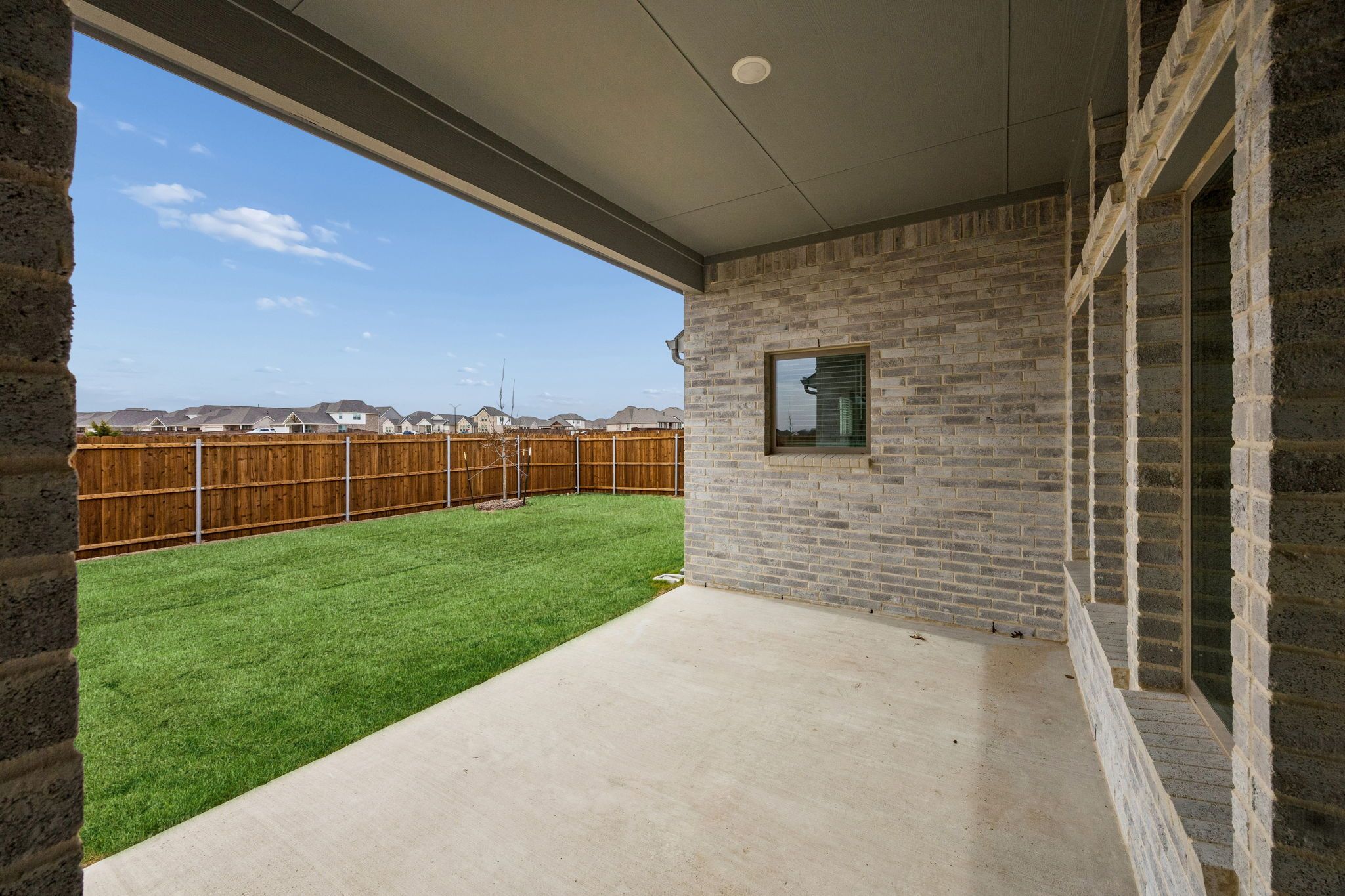 Covered Patio in the Gilmour II home plan by Trophy Signature Homes – REPRESENTATIVE PHOTO
