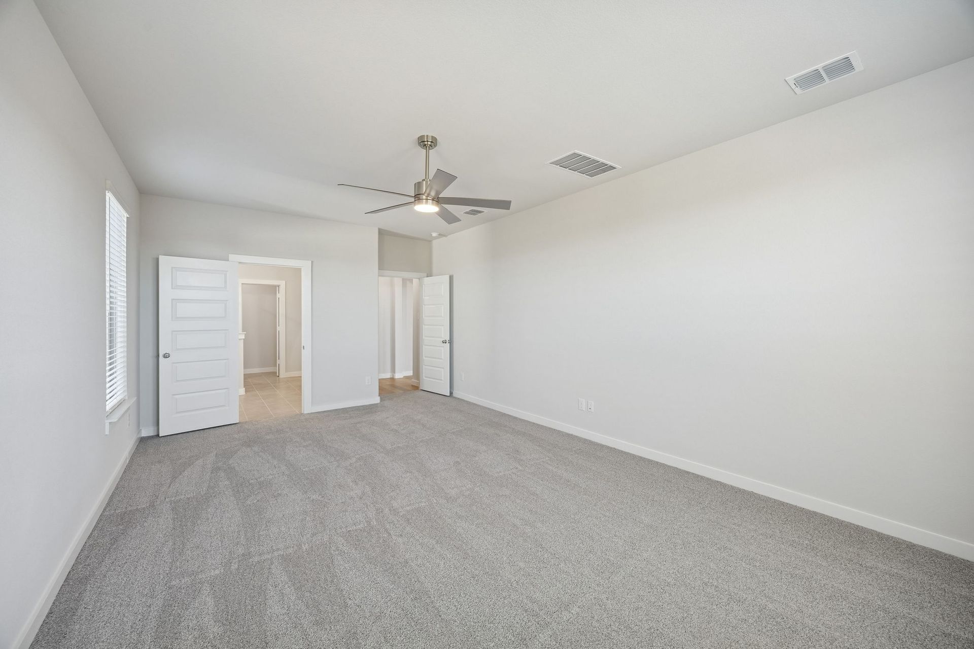 Primary Suite in the Wimbledon home plan by Trophy Signature Homes – REPRESENTATIVE PHOTO