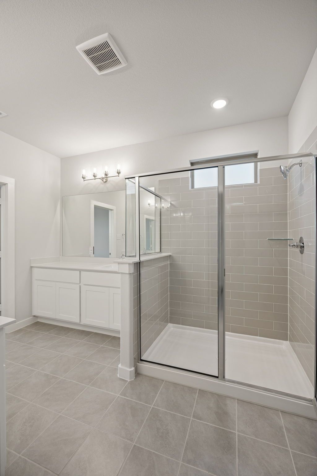 Primary Bathroom in the Wimbledon home plan by Trophy Signature Homes – REPRESENTATIVE PHOTO