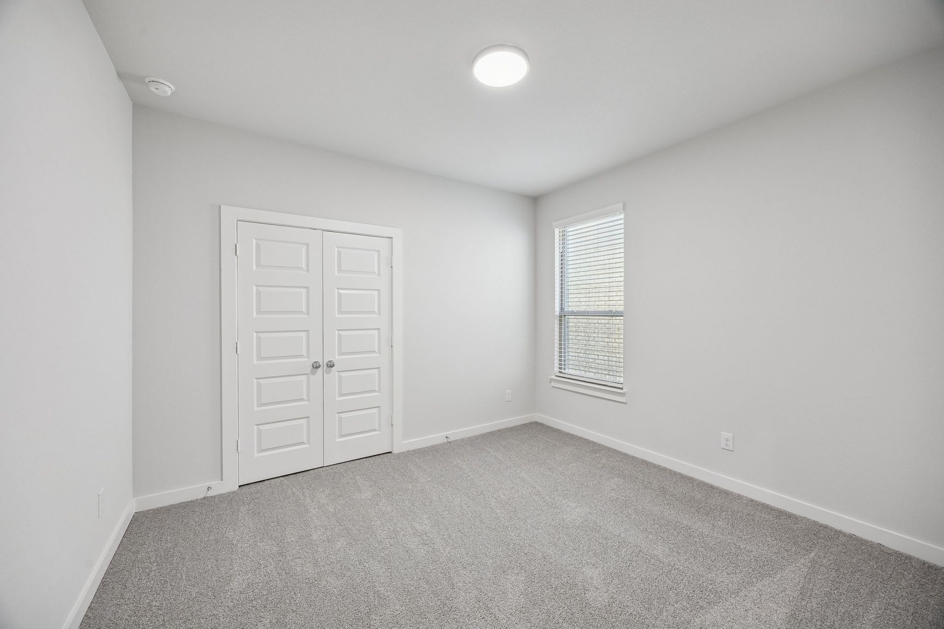 Bedroom in the Wimbledon home plan by Trophy Signature Homes – REPRESENTATIVE PHOTO