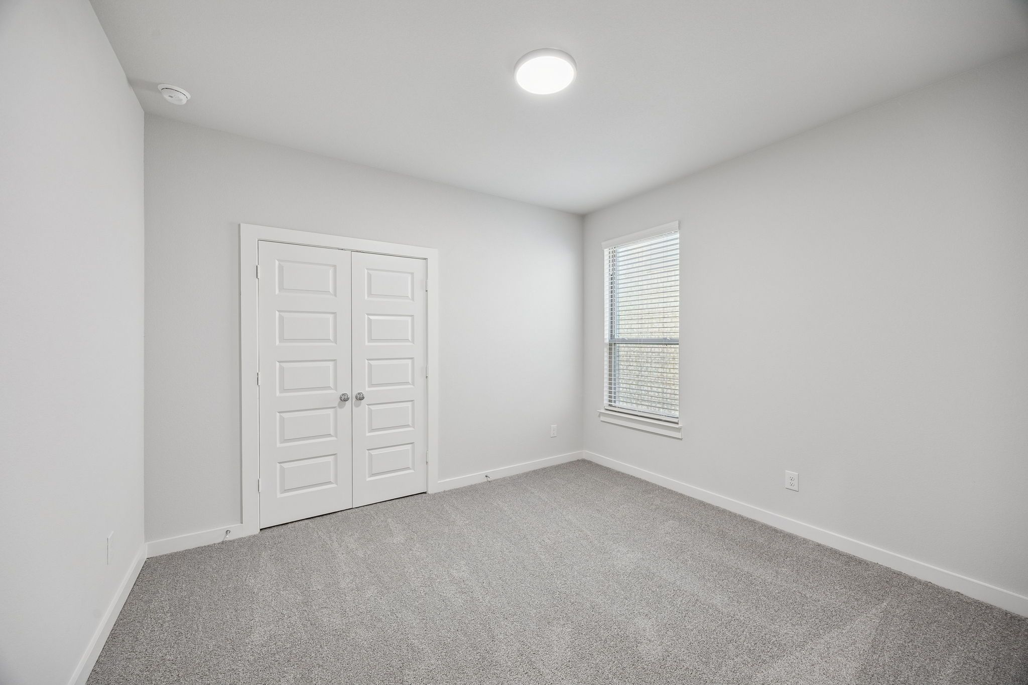 Bedroom in the Wimbledon home plan by Trophy Signature Homes – REPRESENTATIVE PHOTO