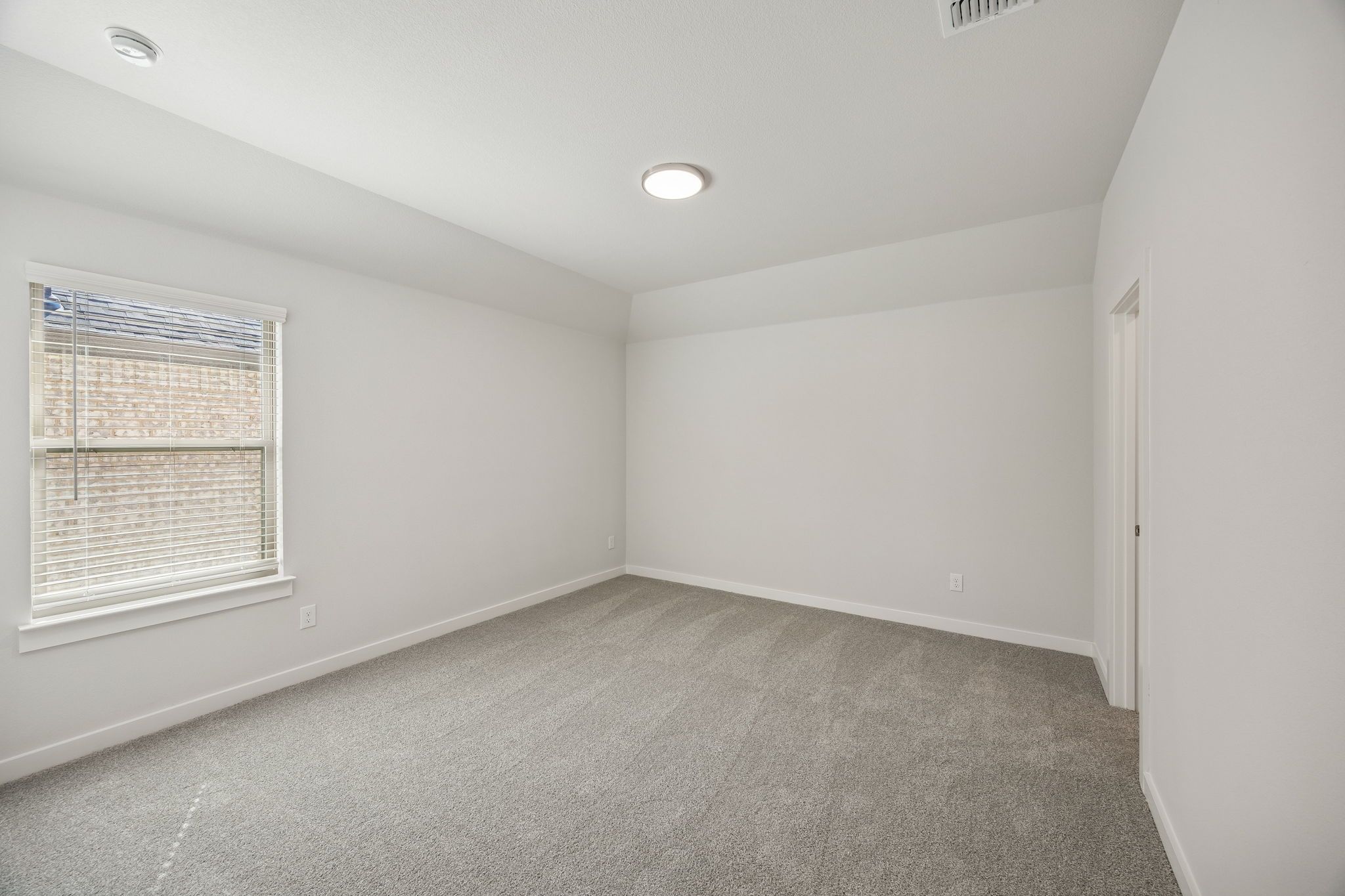 Bedroom in the Wimbledon home plan by Trophy Signature Homes – REPRESENTATIVE PHOTO