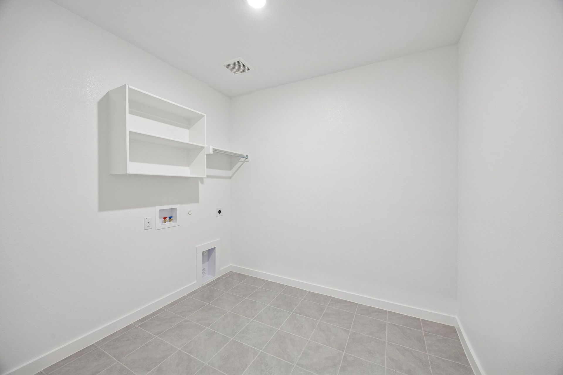 Utility Room in the Wimbledon home plan by Trophy Signature Homes – REPRESENTATIVE PHOTO
