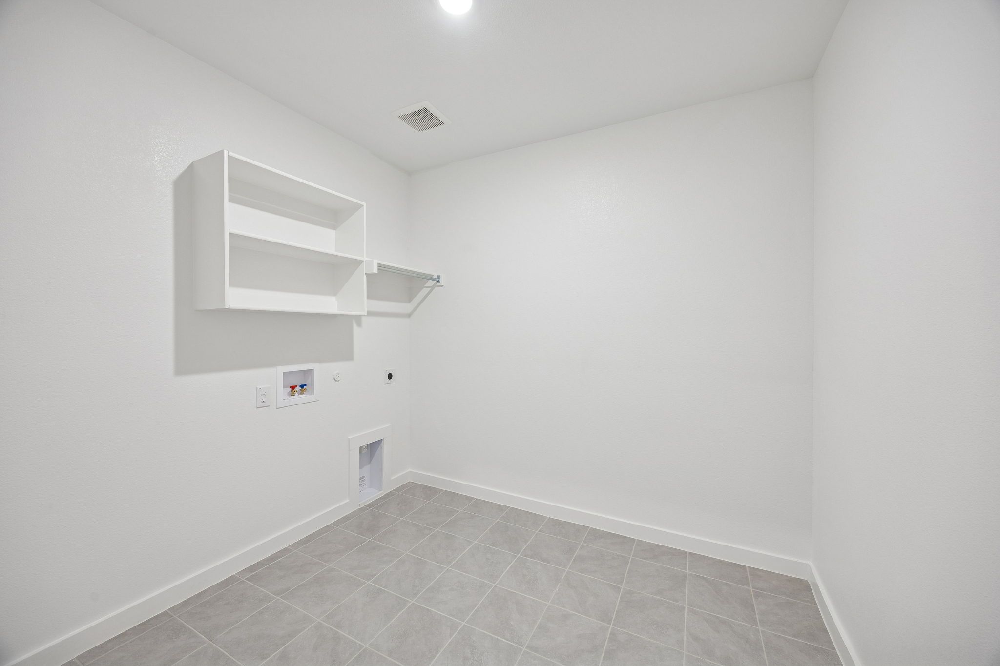 Utility Room in the Wimbledon home plan by Trophy Signature Homes – REPRESENTATIVE PHOTO
