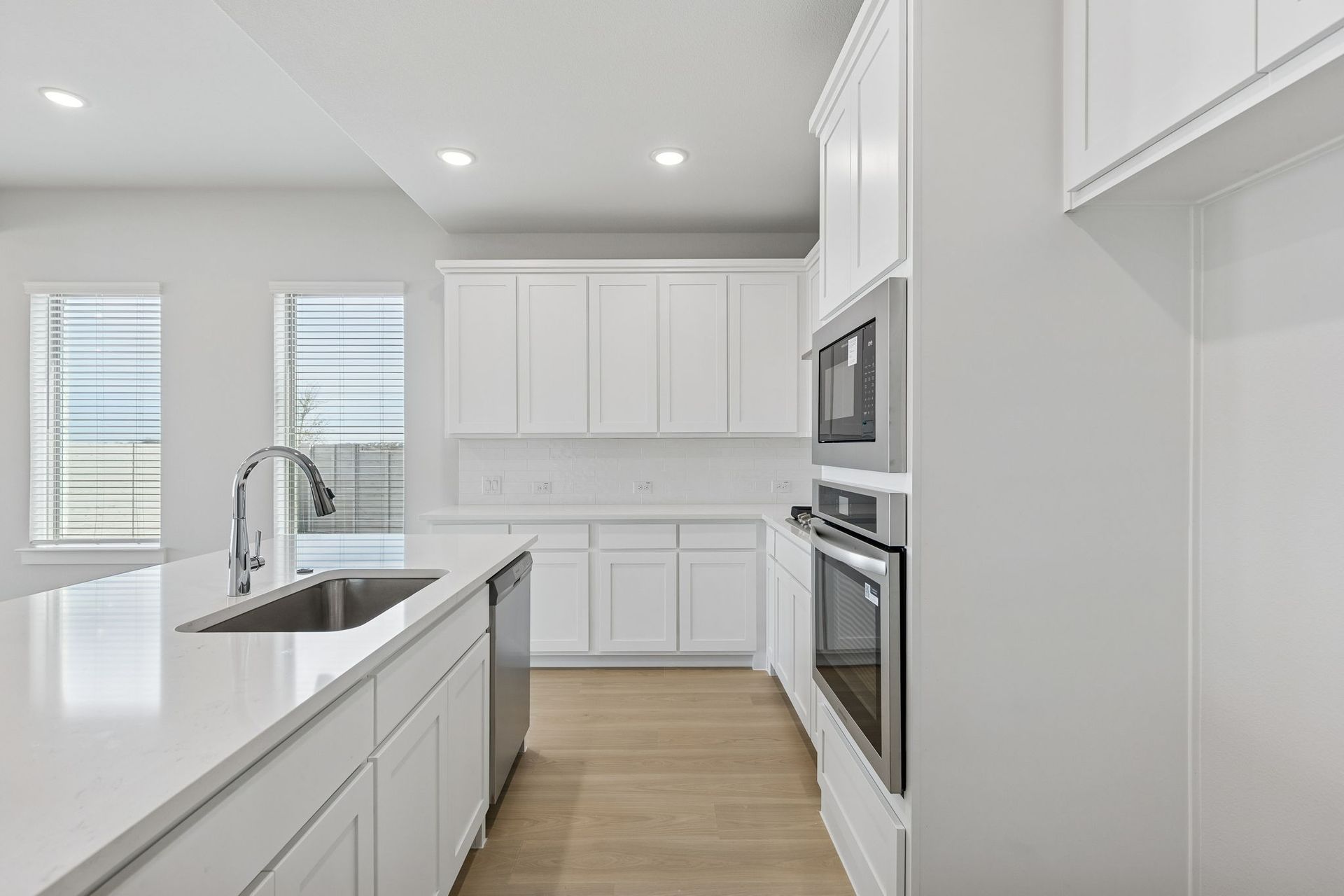 Kitchen in the Stanley II home plan by Trophy Signature Homes – REPRESENTATIVE PHOTO