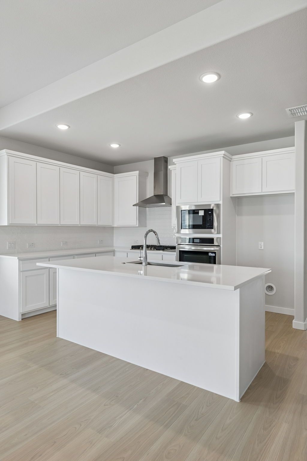 Kitchen in the Stanley II home plan by Trophy Signature Homes – REPRESENTATIVE PHOTO