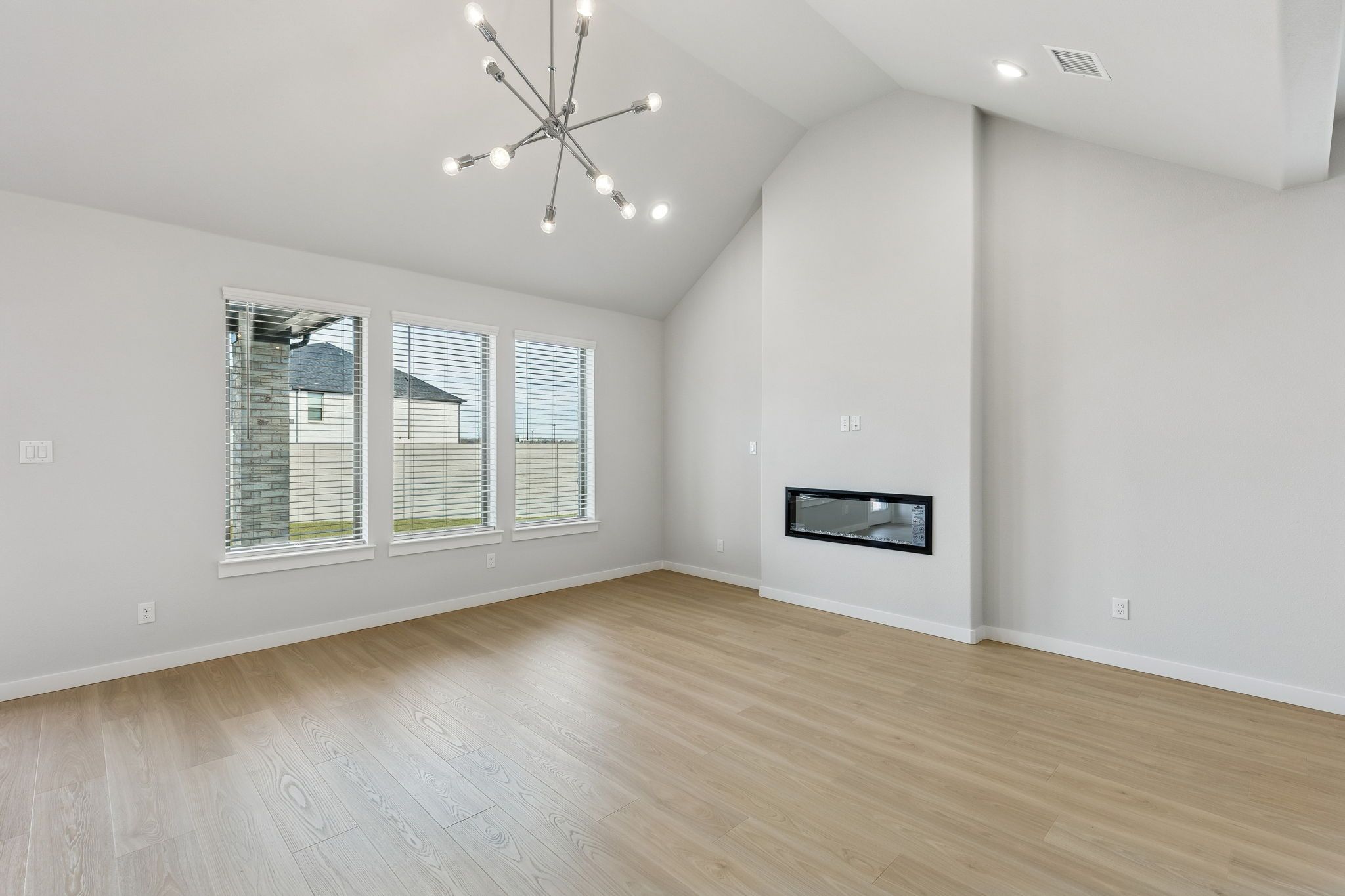 Living Room in the Stanley II home plan by Trophy Signature Homes – REPRESENTATIVE PHOTO