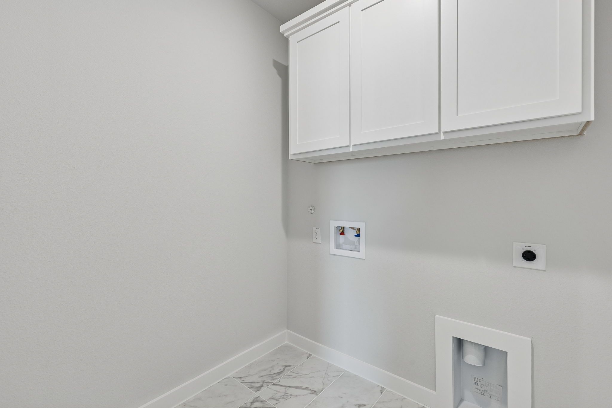 Utility Room in the Stanley II home plan by Trophy Signature Homes – REPRESENTATIVE PHOTO