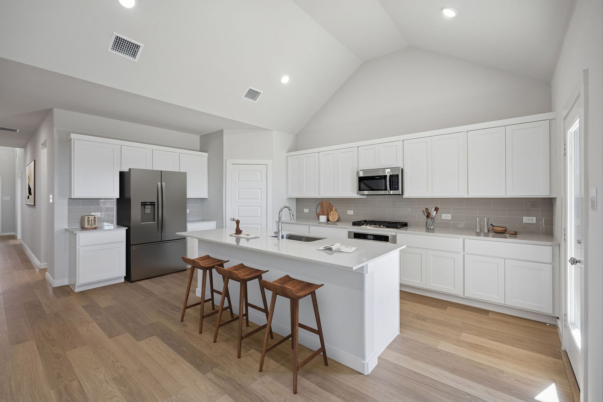 Kitchen in the Wimbledon home plan by Trophy Signature Homes – REPRESENTATIVE PHOTO
