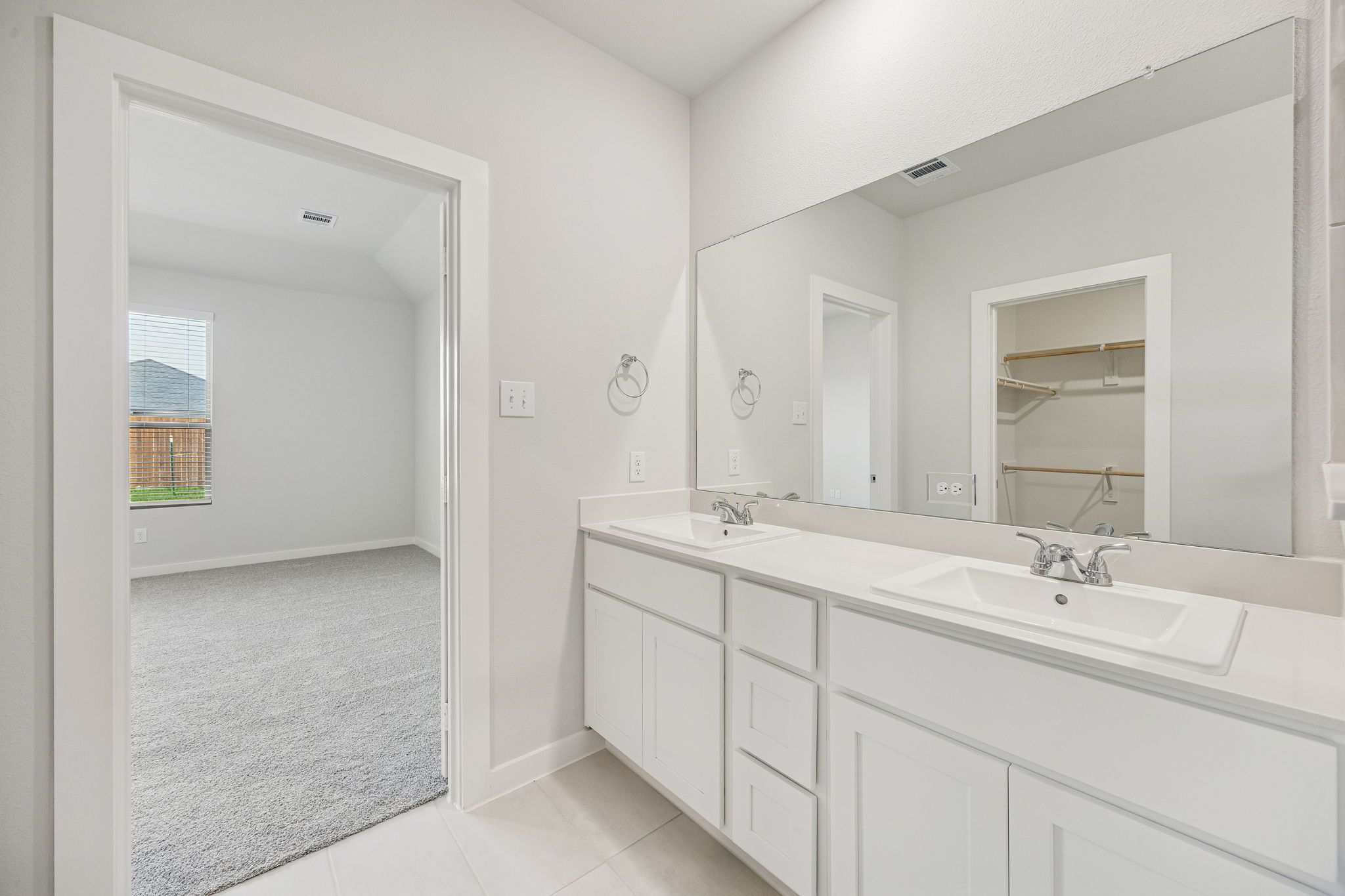 Primary Bathroom in the Stanley II home plan by Trophy Signature Homes – REPRESENTATIVE PHOTO