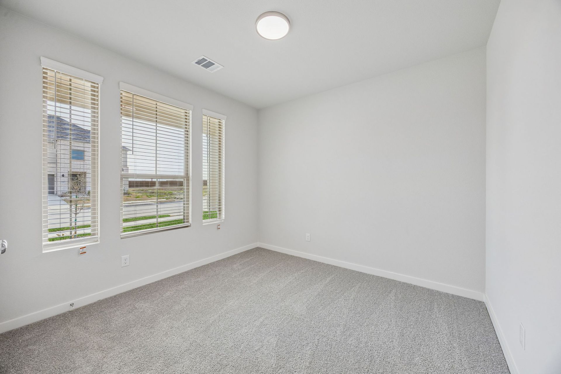 Bedroom in the Stanley II home plan by Trophy Signature Homes – REPRESENTATIVE PHOTO