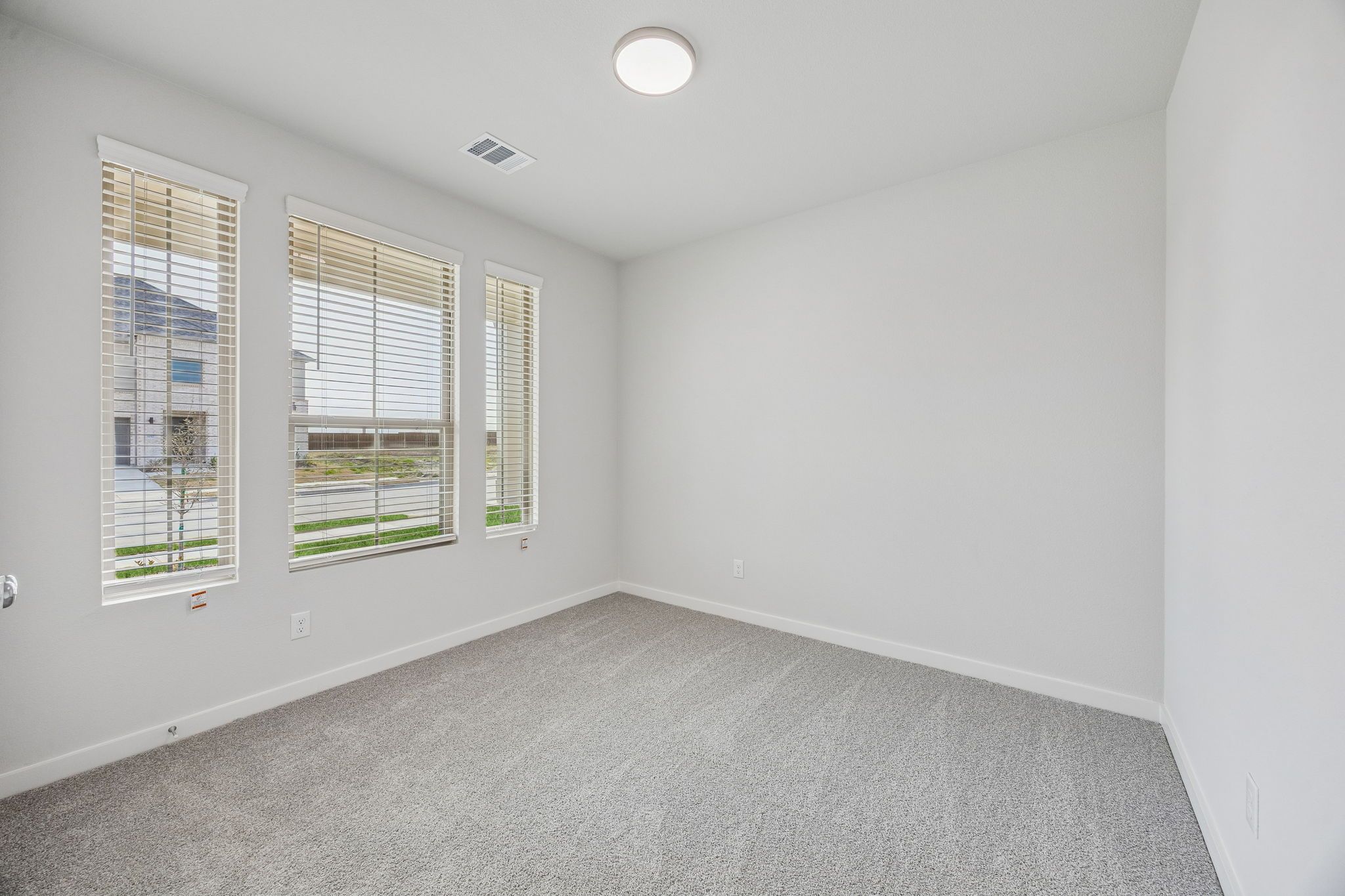 Bedroom in the Stanley II home plan by Trophy Signature Homes – REPRESENTATIVE PHOTO