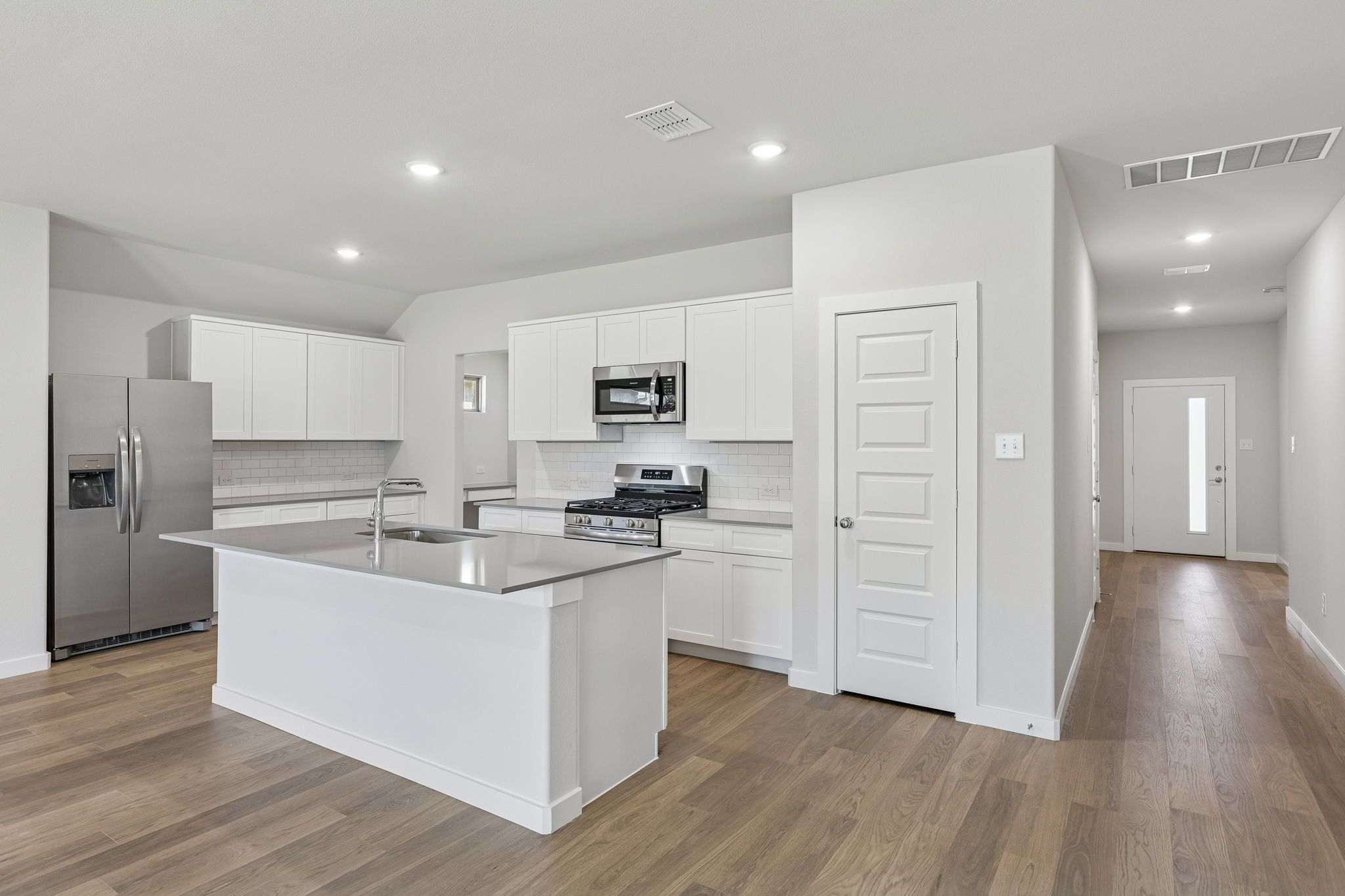 Kitchen in the Harrison home plan by Trophy Signature Homes – REPRESENTATIVE PHOTO