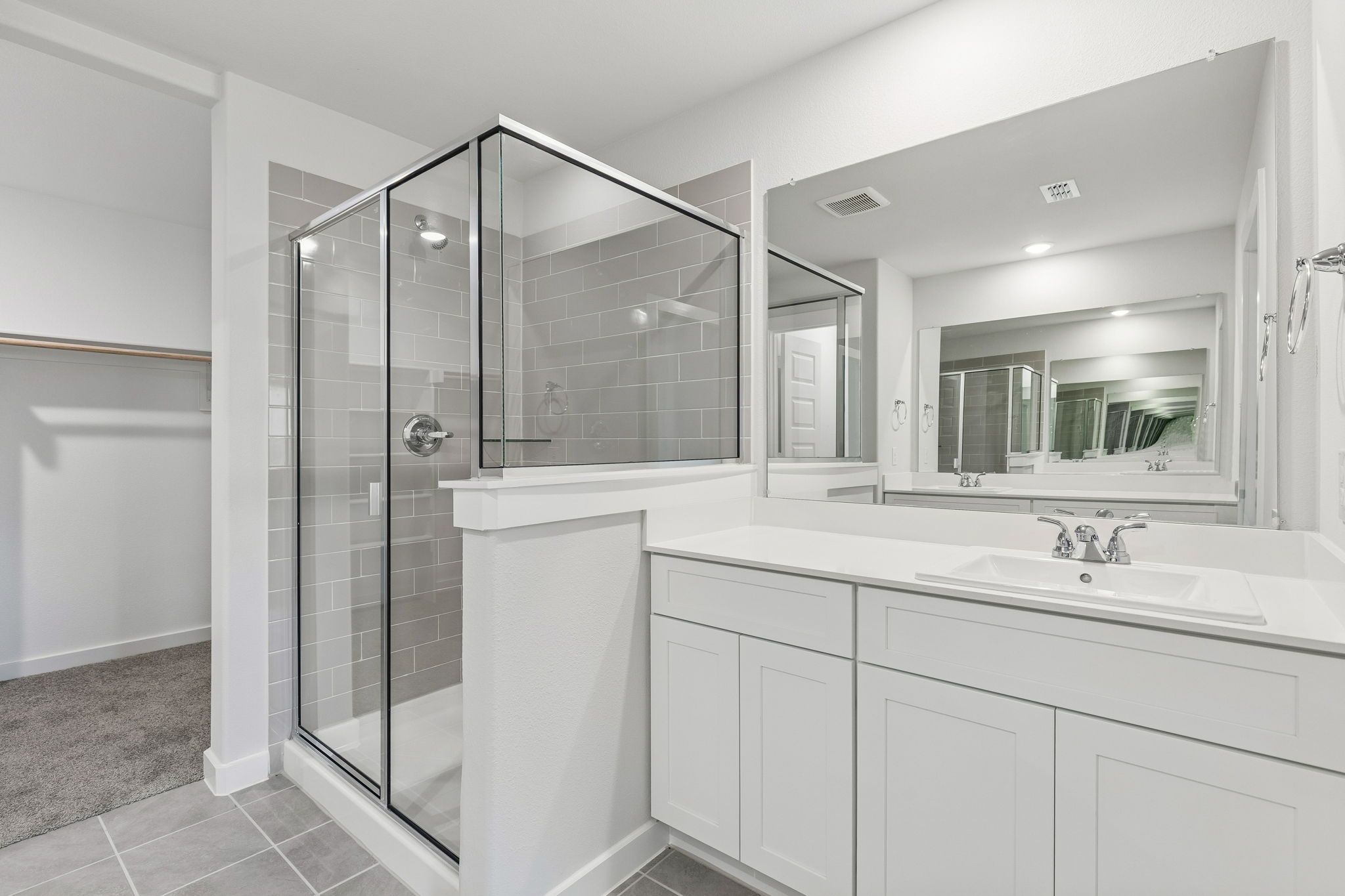 Primary Bathroom in the Harrison home plan by Trophy Signature Homes – REPRESENTATIVE PHOTO