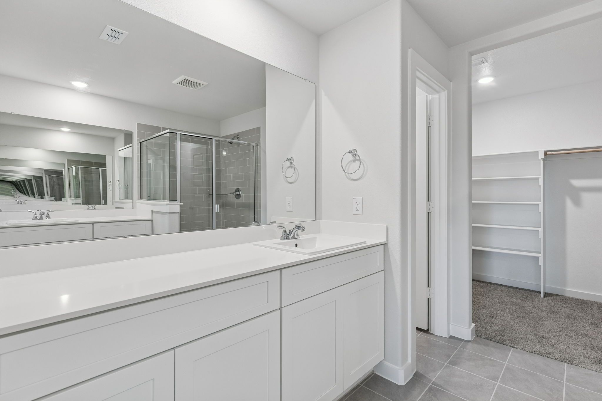 Primary Bathroom in the Harrison home plan by Trophy Signature Homes – REPRESENTATIVE PHOTO