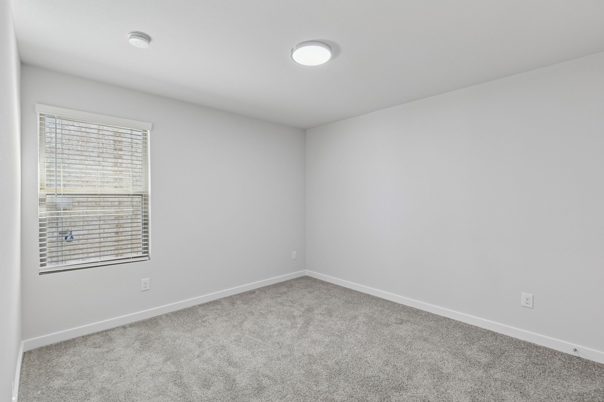 Bedroom in the Harrison home plan by Trophy Signature Homes – REPRESENTATIVE PHOTO