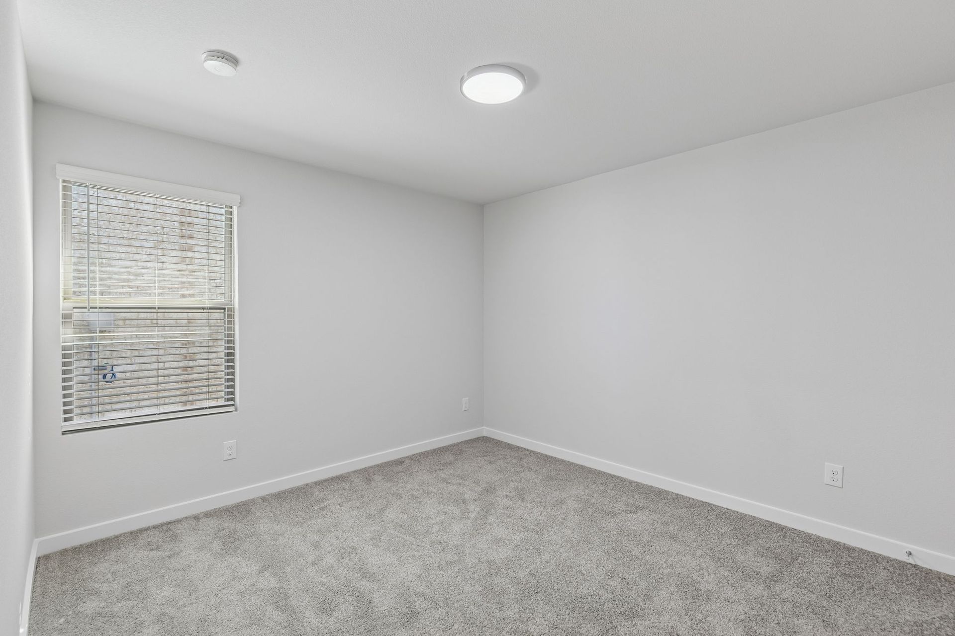 Bedroom in the Harrison home plan by Trophy Signature Homes – REPRESENTATIVE PHOTO