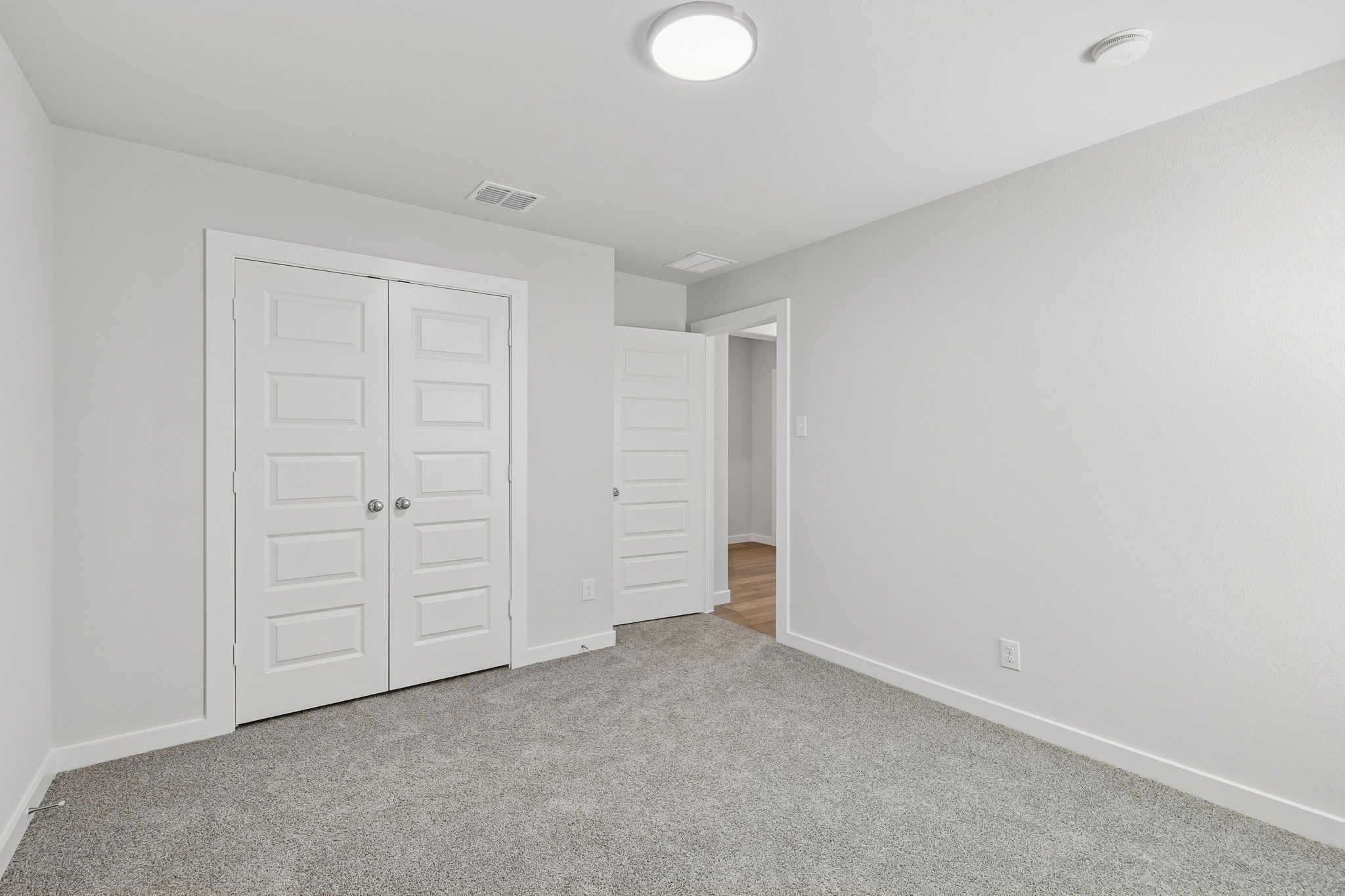 Bedroom in the Harrison home plan by Trophy Signature Homes – REPRESENTATIVE PHOTO