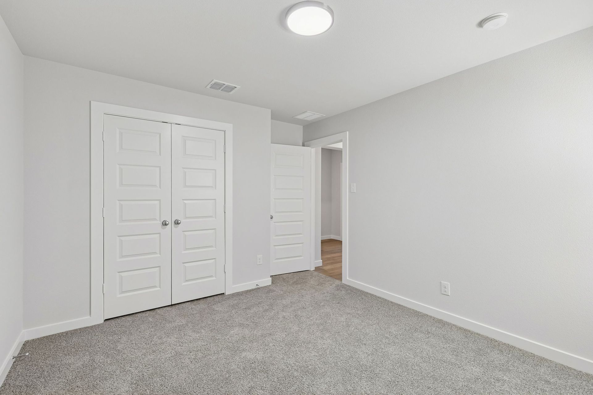 Bedroom in the Harrison home plan by Trophy Signature Homes – REPRESENTATIVE PHOTO