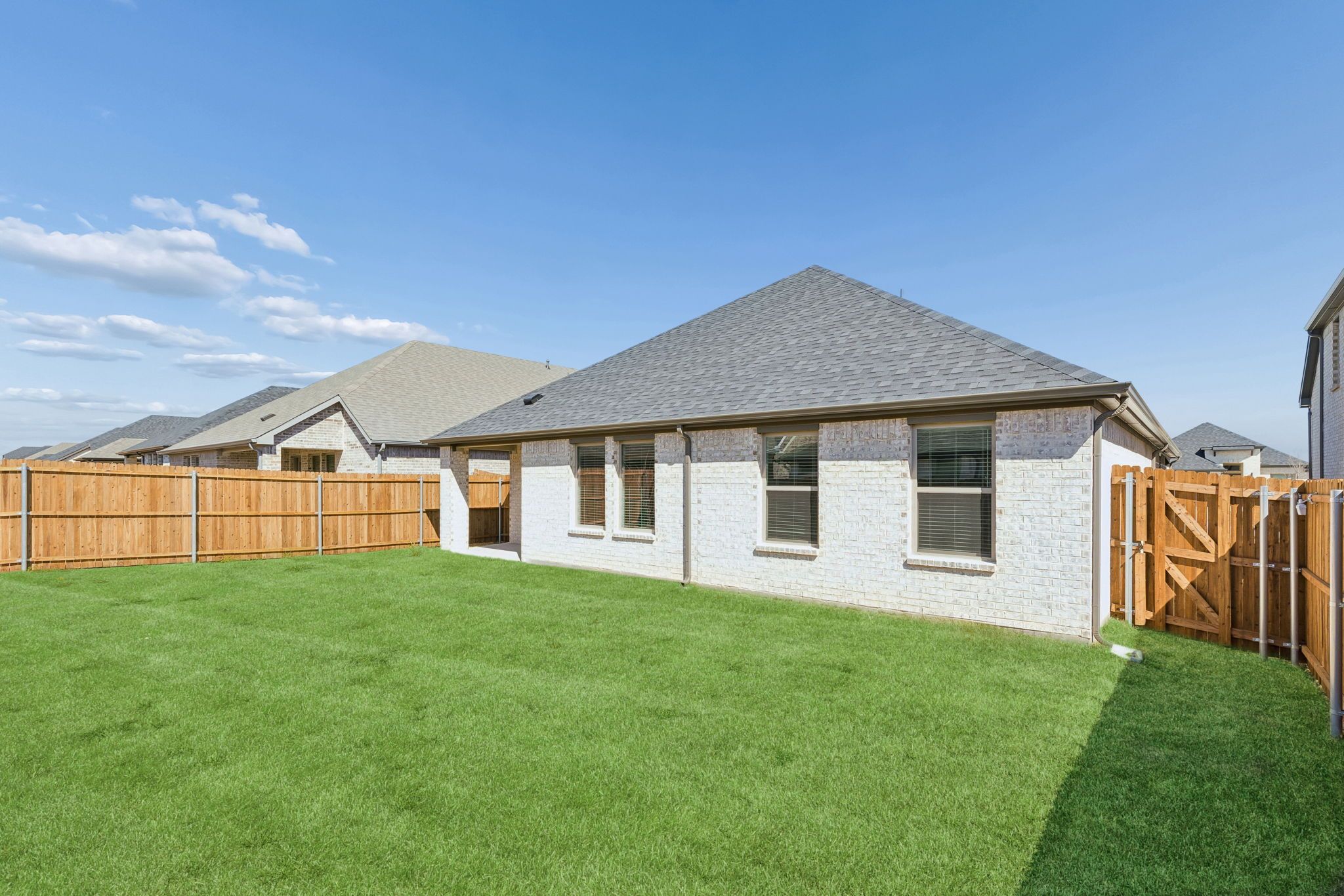 Covered Patio in the Harrison home plan by Trophy Signature Homes – REPRESENTATIVE PHOTO