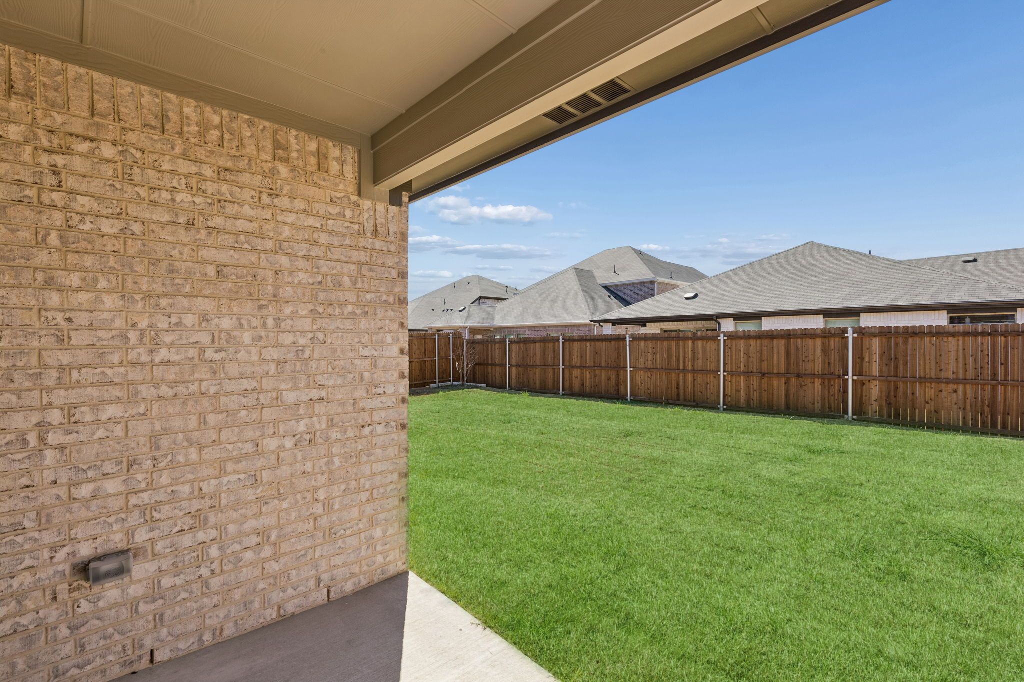 Covered Patio in the Harrison home plan by Trophy Signature Homes – REPRESENTATIVE PHOTO