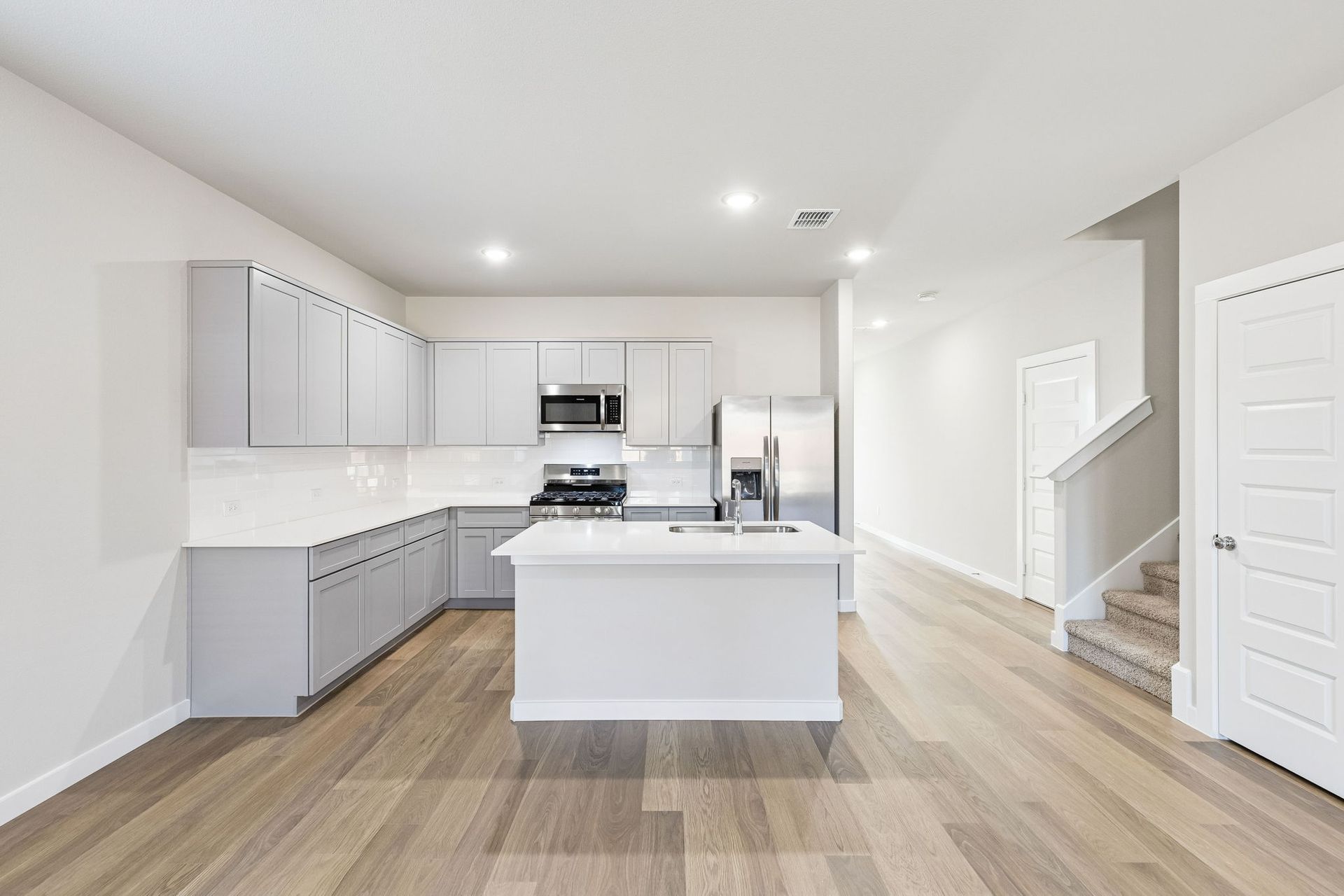 Kitchen in the Haylee home plan by Trophy Signature Homes - REPRESENTATIVE PHOTO