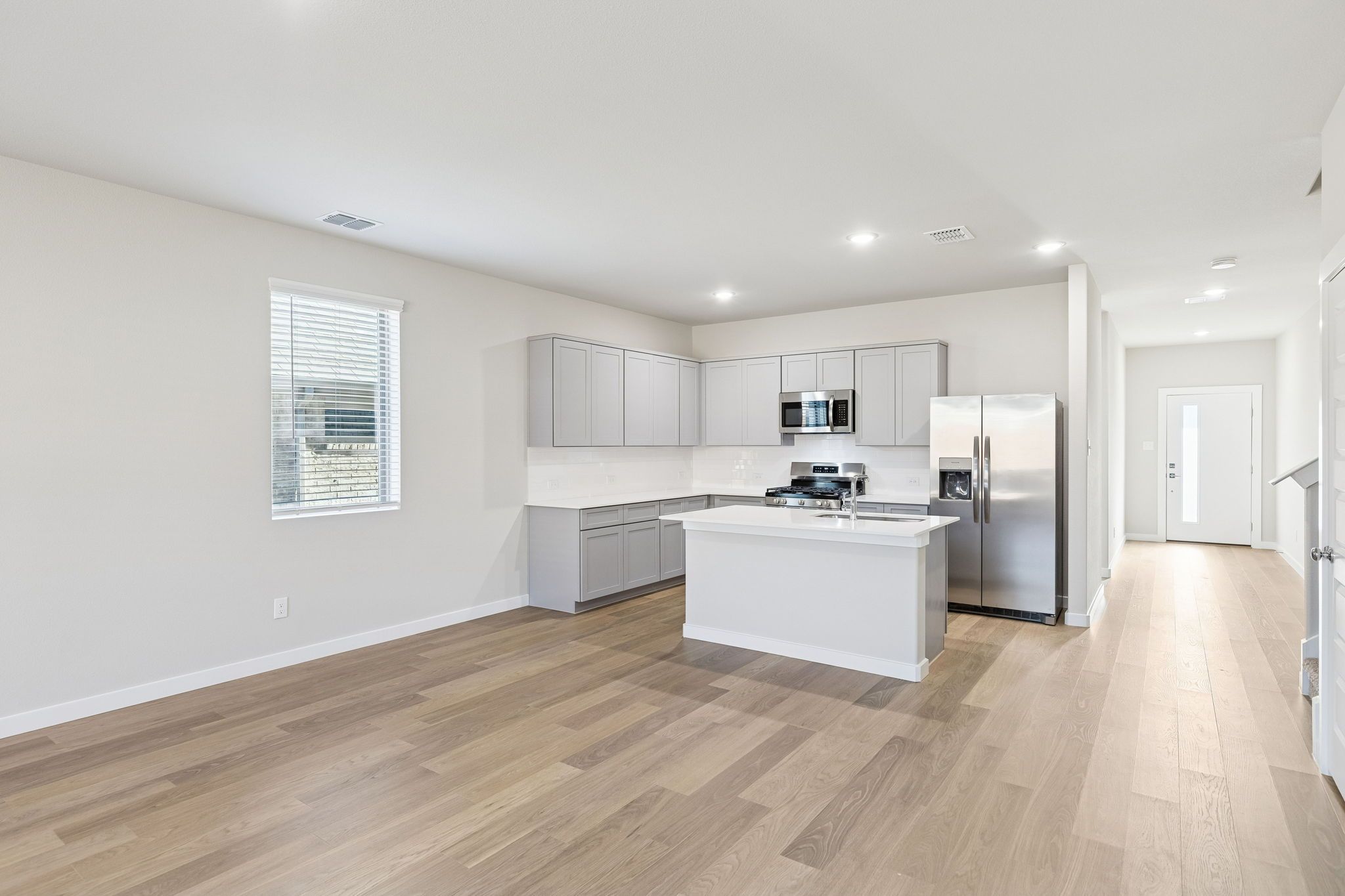 Kitchen and Dining Room in the Haylee home plan by Trophy Signature Homes - REPRESENTATIVE PHOTO