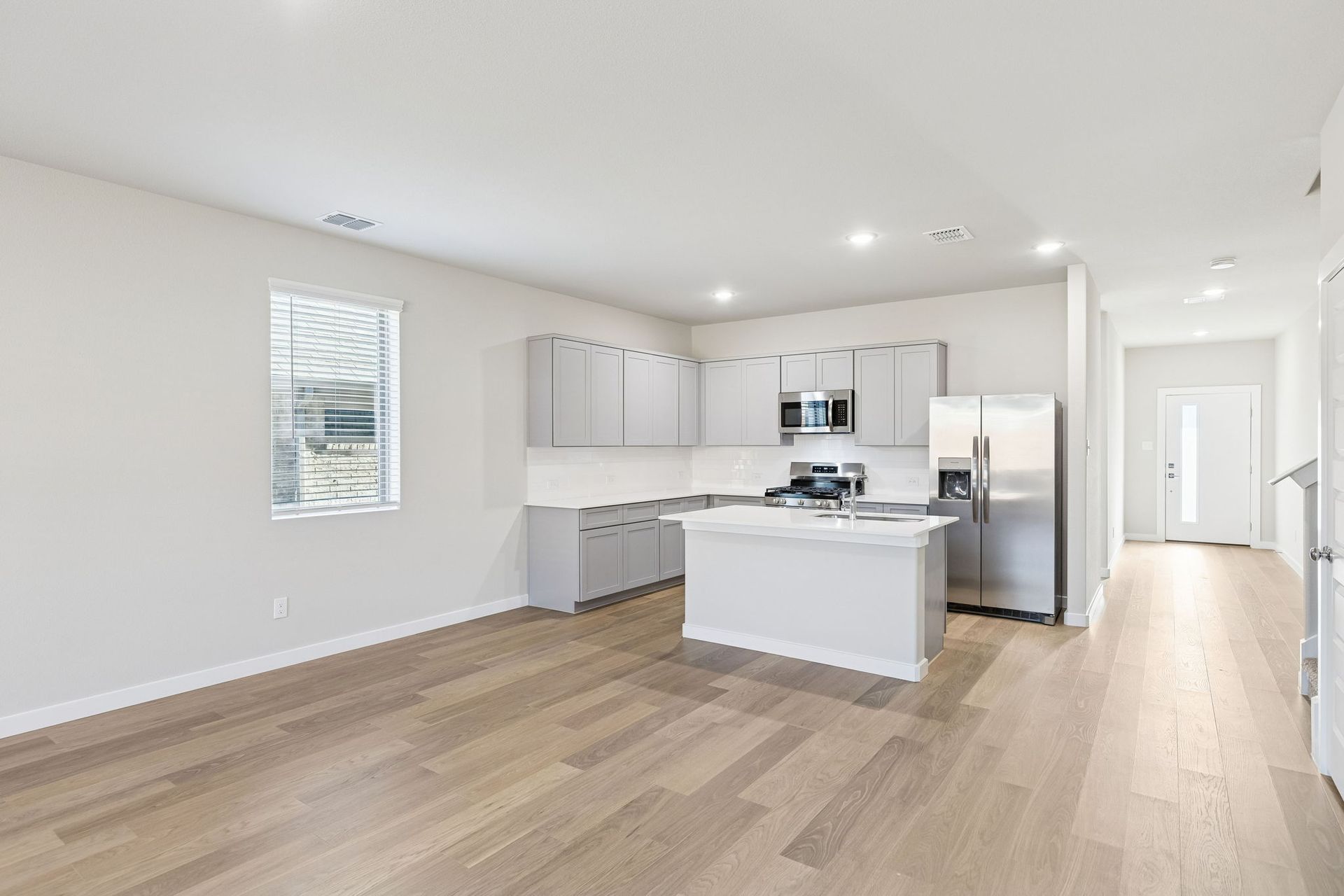 Kitchen and Dining Room in the Haylee home plan by Trophy Signature Homes - REPRESENTATIVE PHOTO