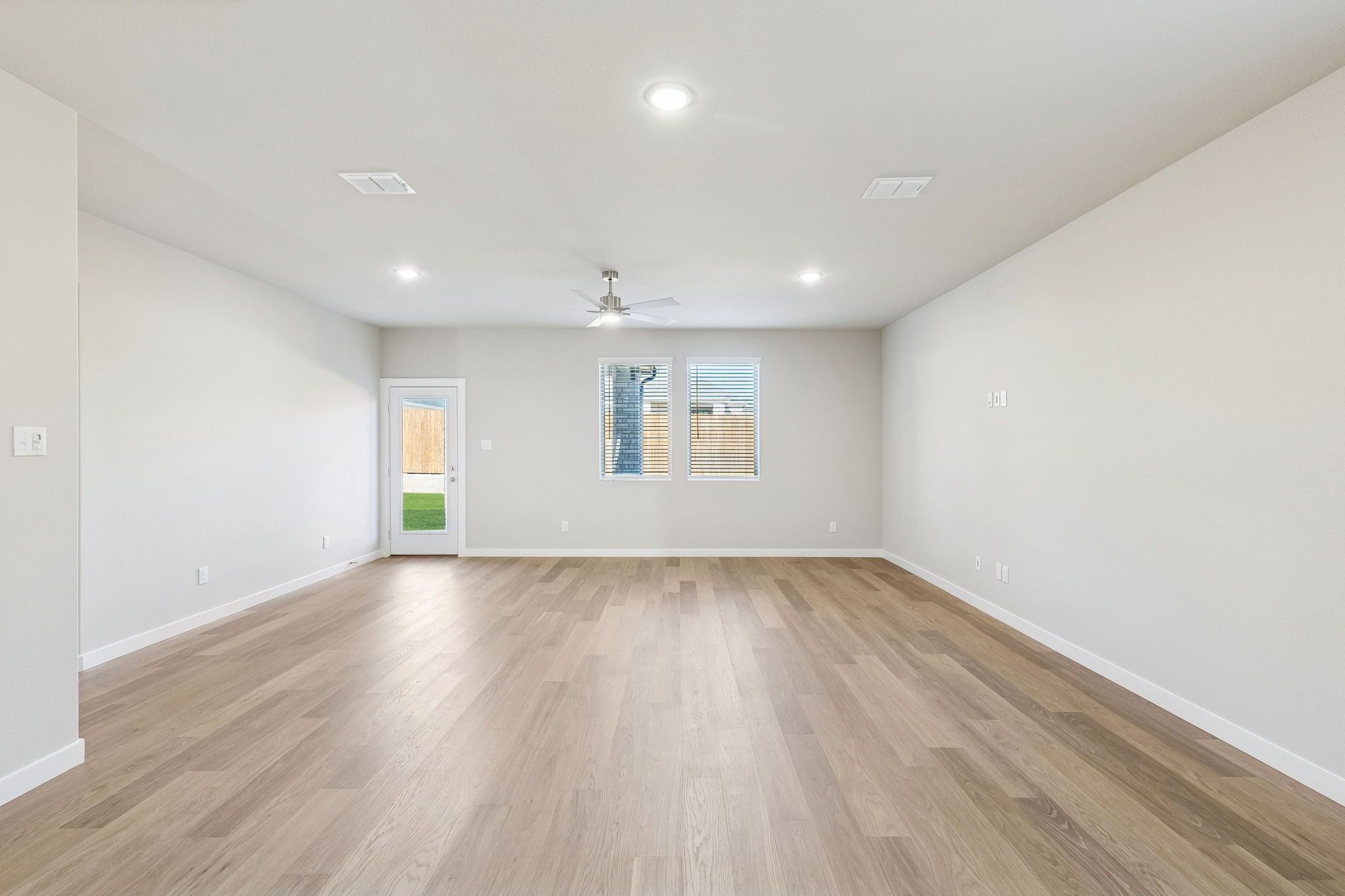Living and Dining Room in the Haylee home plan by Trophy Signature Homes - REPRESENTATIVE PHOTO