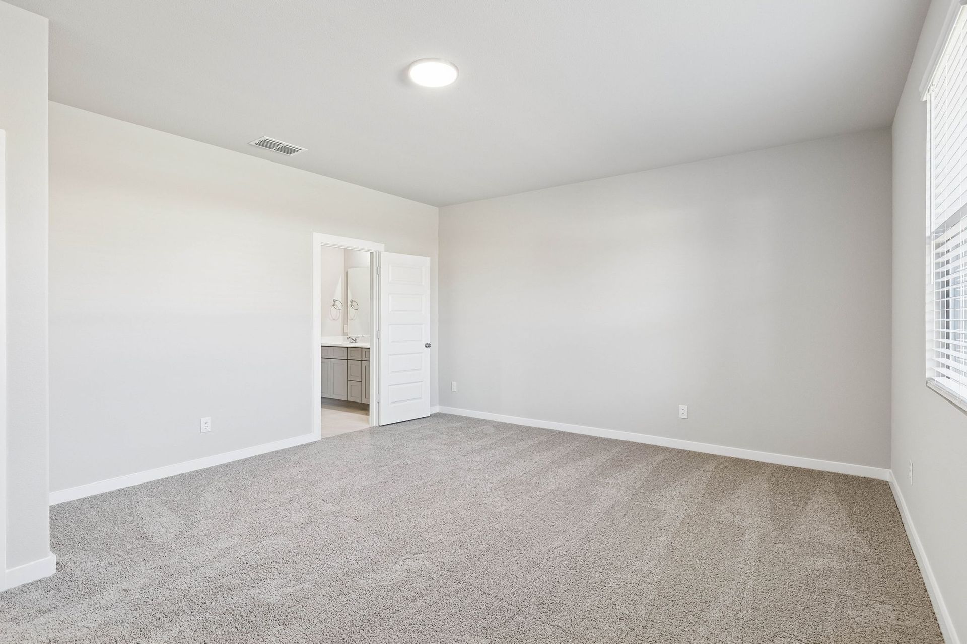 Primary Suite in the Haylee home plan by Trophy Signature Homes - REPRESENTATIVE PHOTO