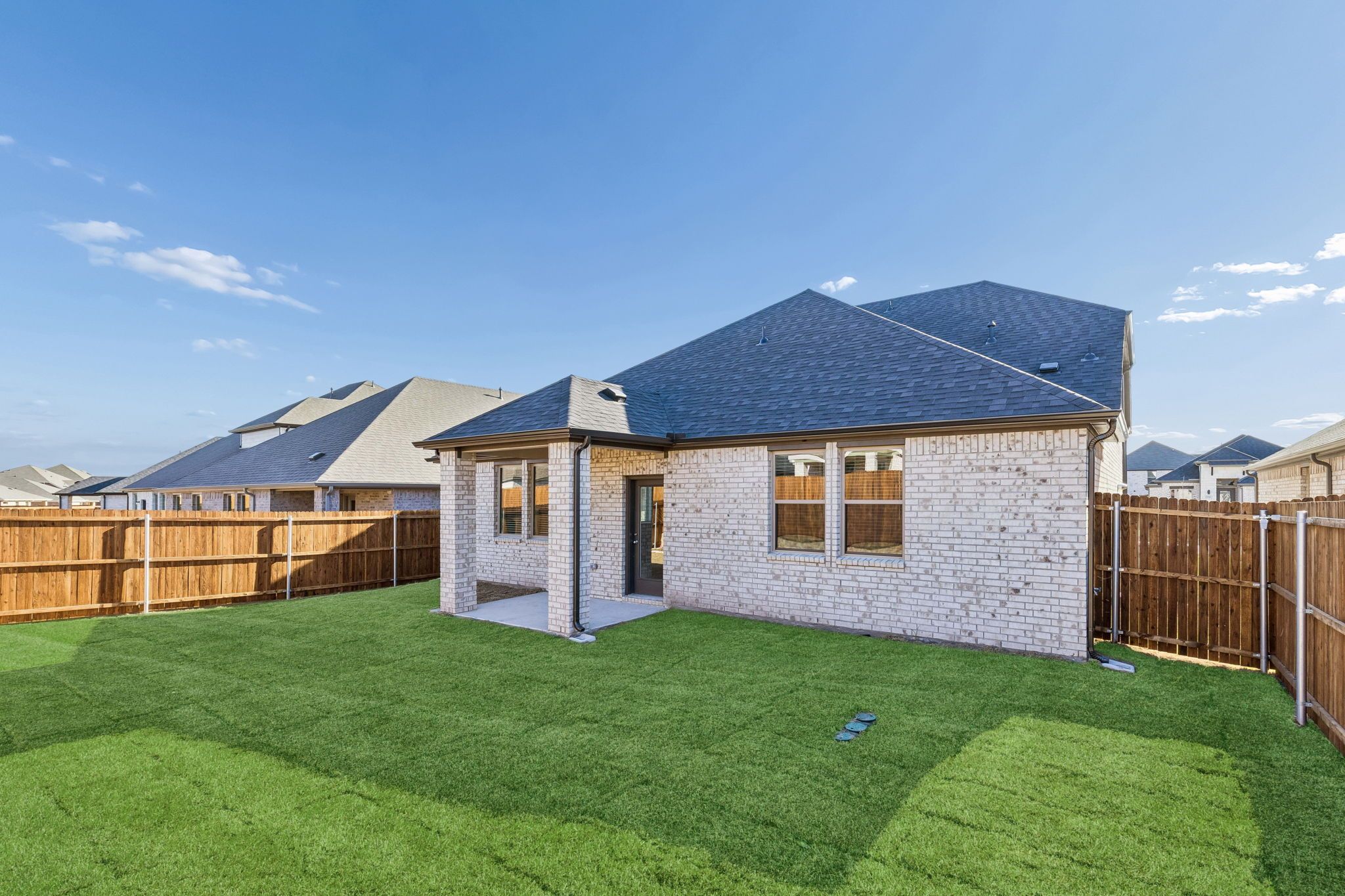 Covered Patio in the Haylee home plan by Trophy Signature Homes - REPRESENTATIVE PHOTO