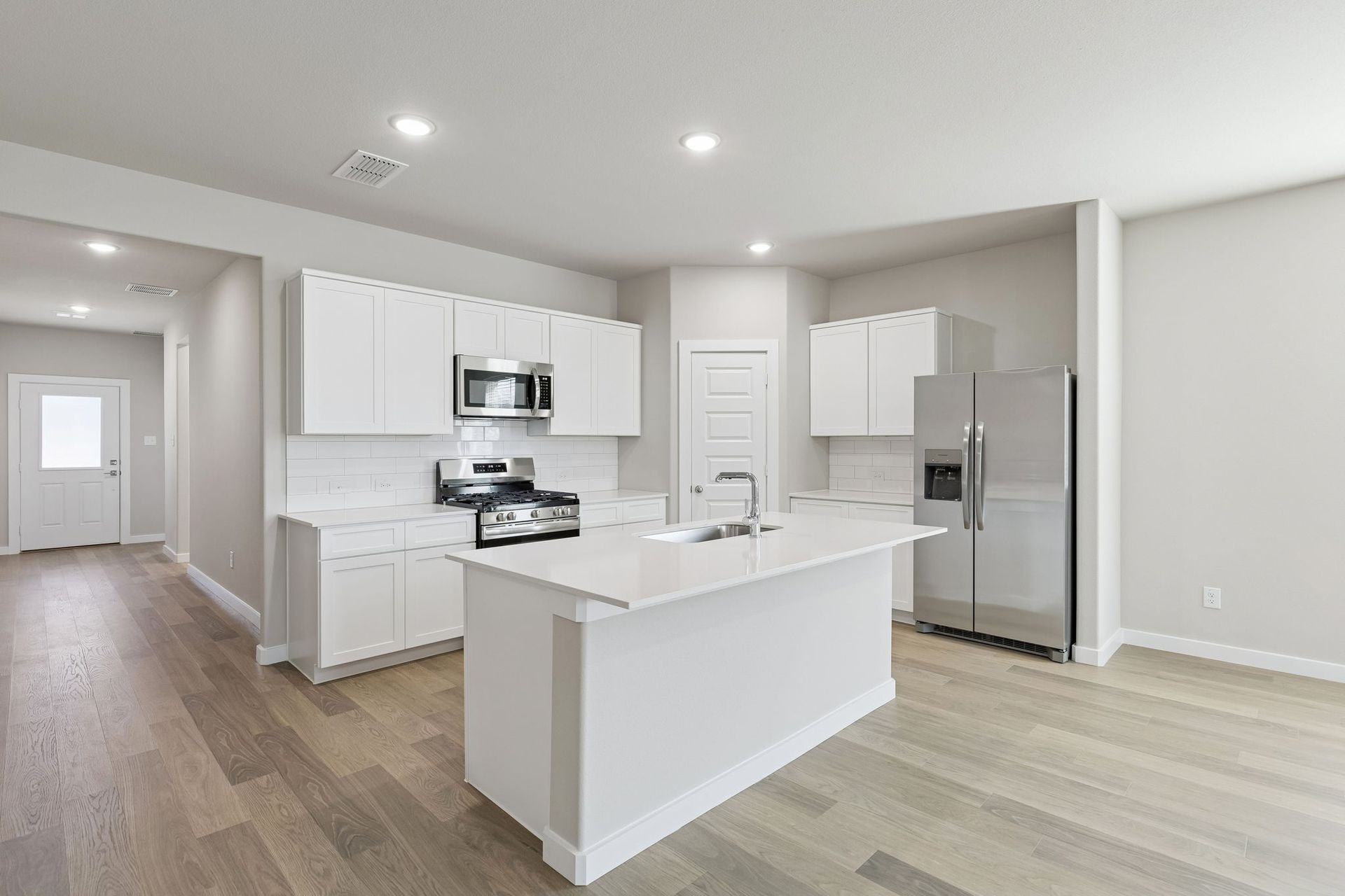Kitchen in the Holden home plan by Trophy Signature Homes – REPRESENTATIVE PHOTO