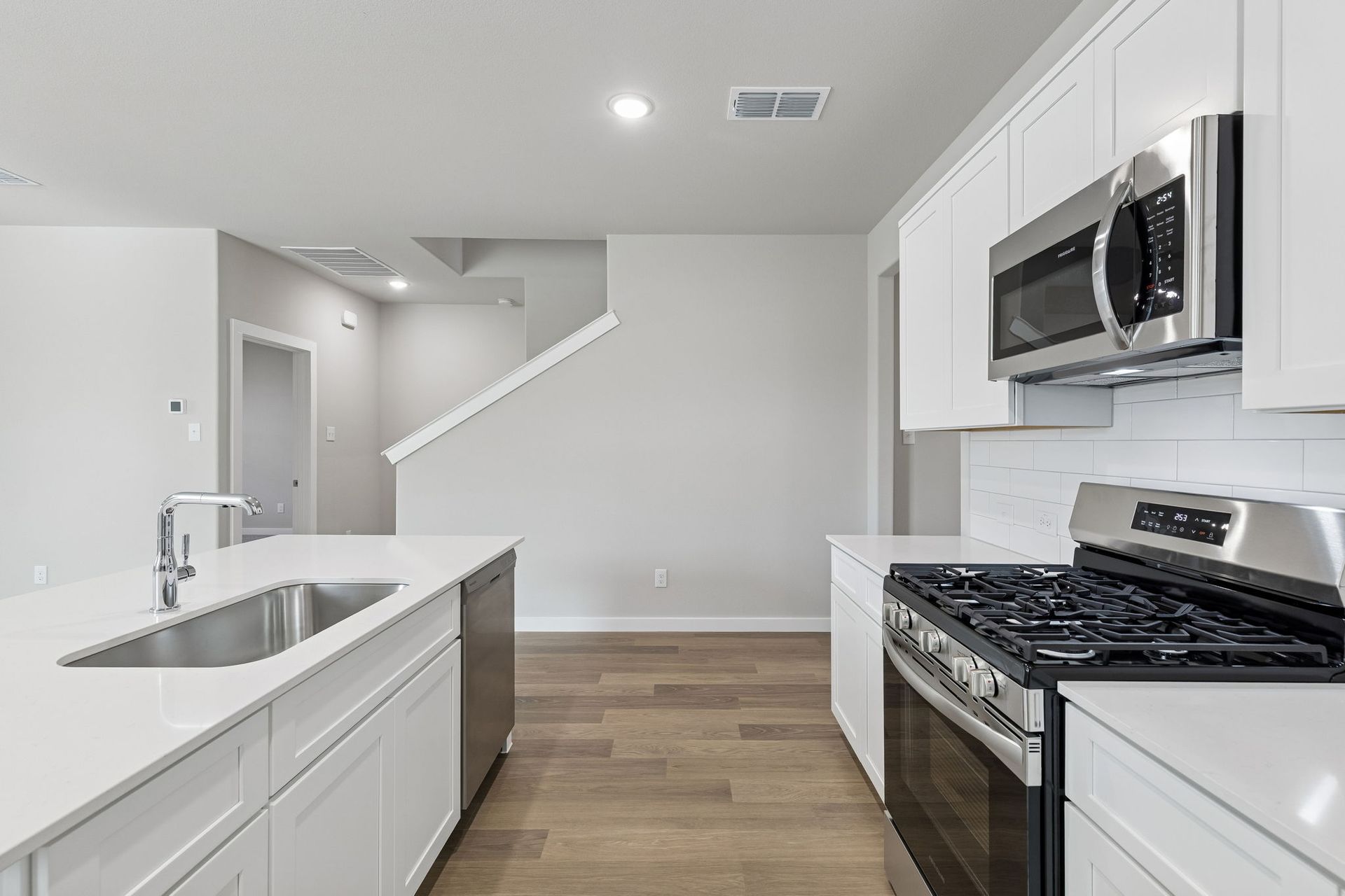 Kitchen in the Holden home plan by Trophy Signature Homes – REPRESENTATIVE PHOTO
