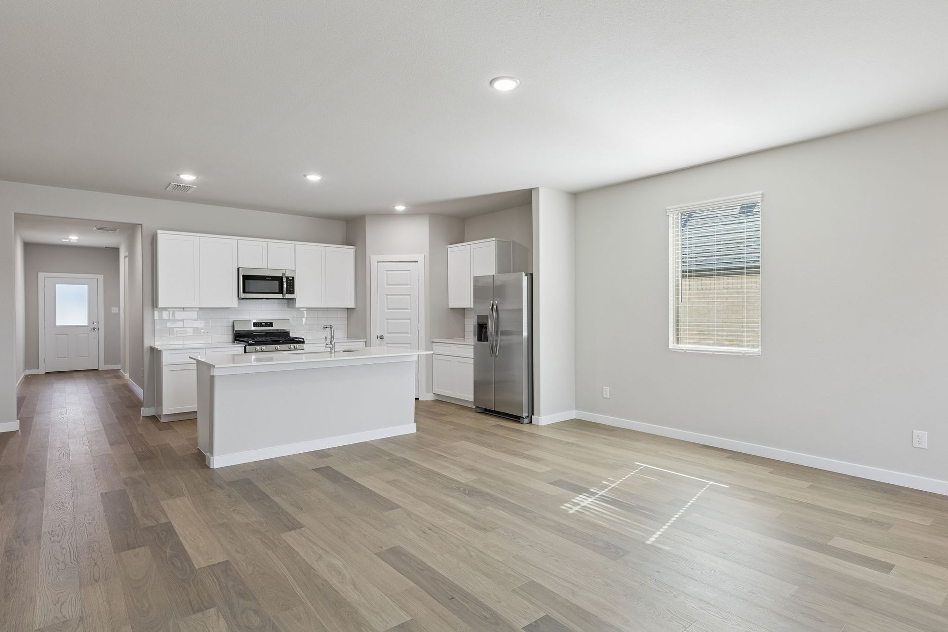 Kitchen and Dining Room in the Holden home plan by Trophy Signature Homes – REPRESENTATIVE PHOTO