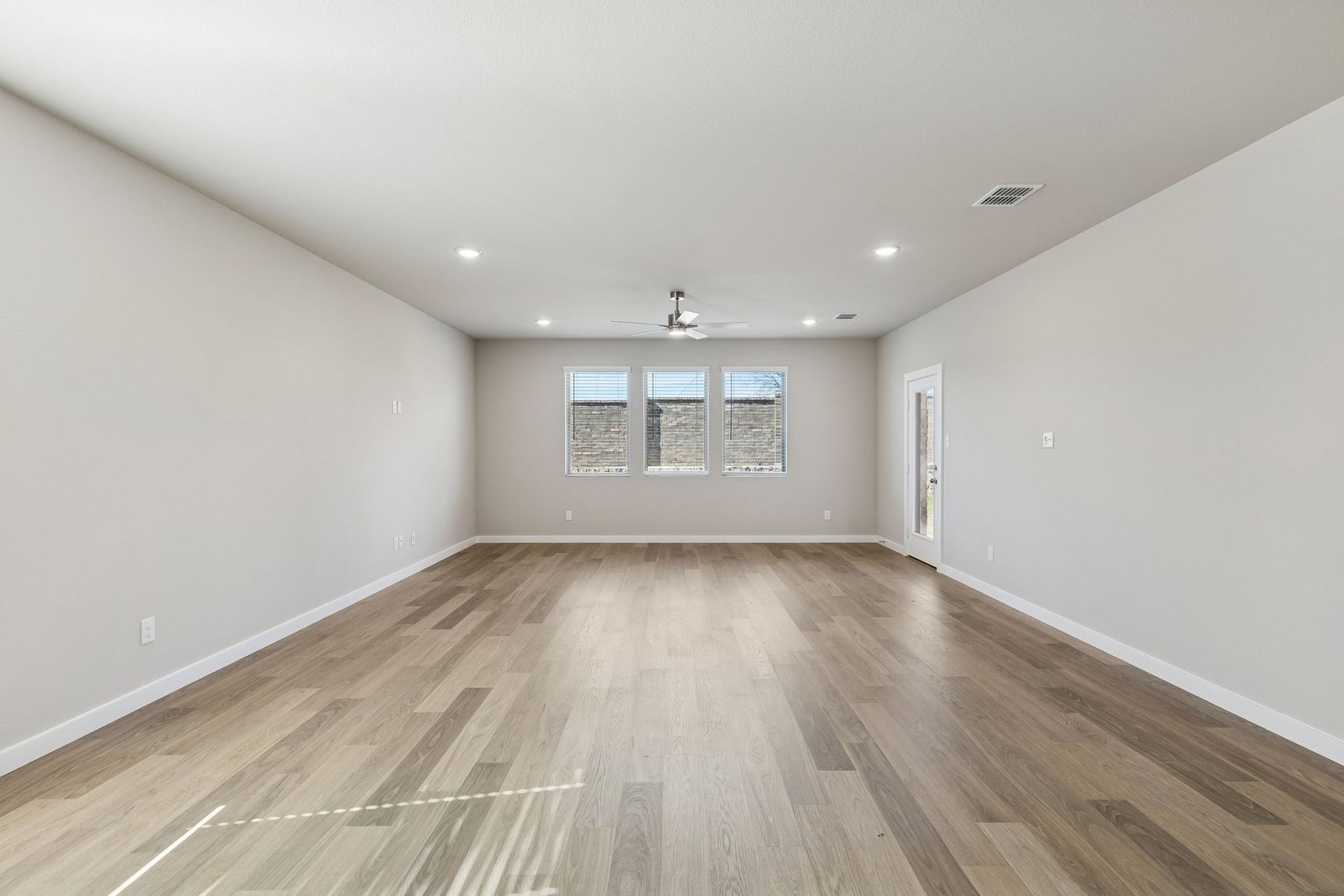 Living and Dining Room in the Holden home plan by Trophy Signature Homes – REPRESENTATIVE PHOTO