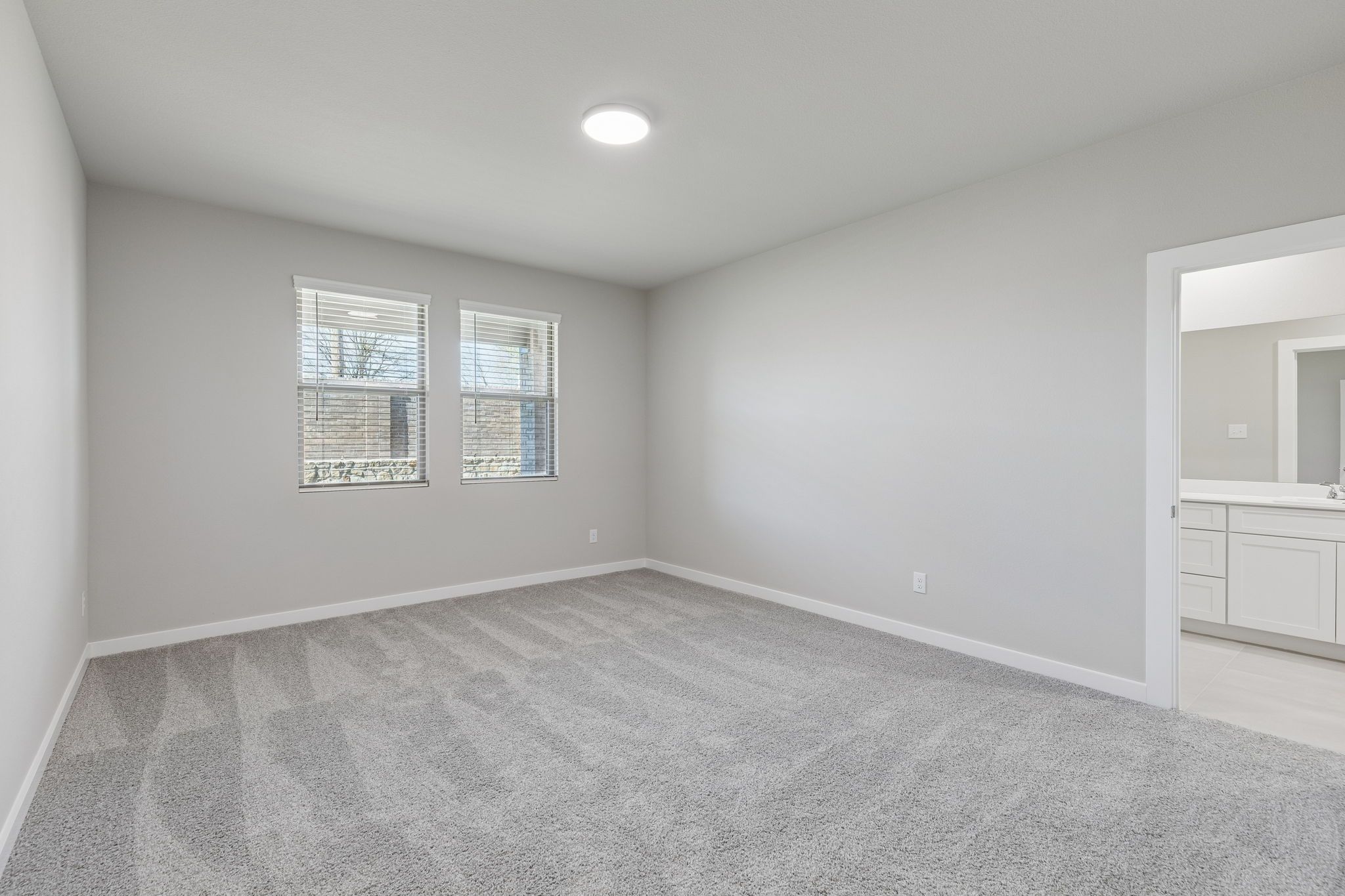 Primary Suite in the Holden home plan by Trophy Signature Homes – REPRESENTATIVE PHOTO
