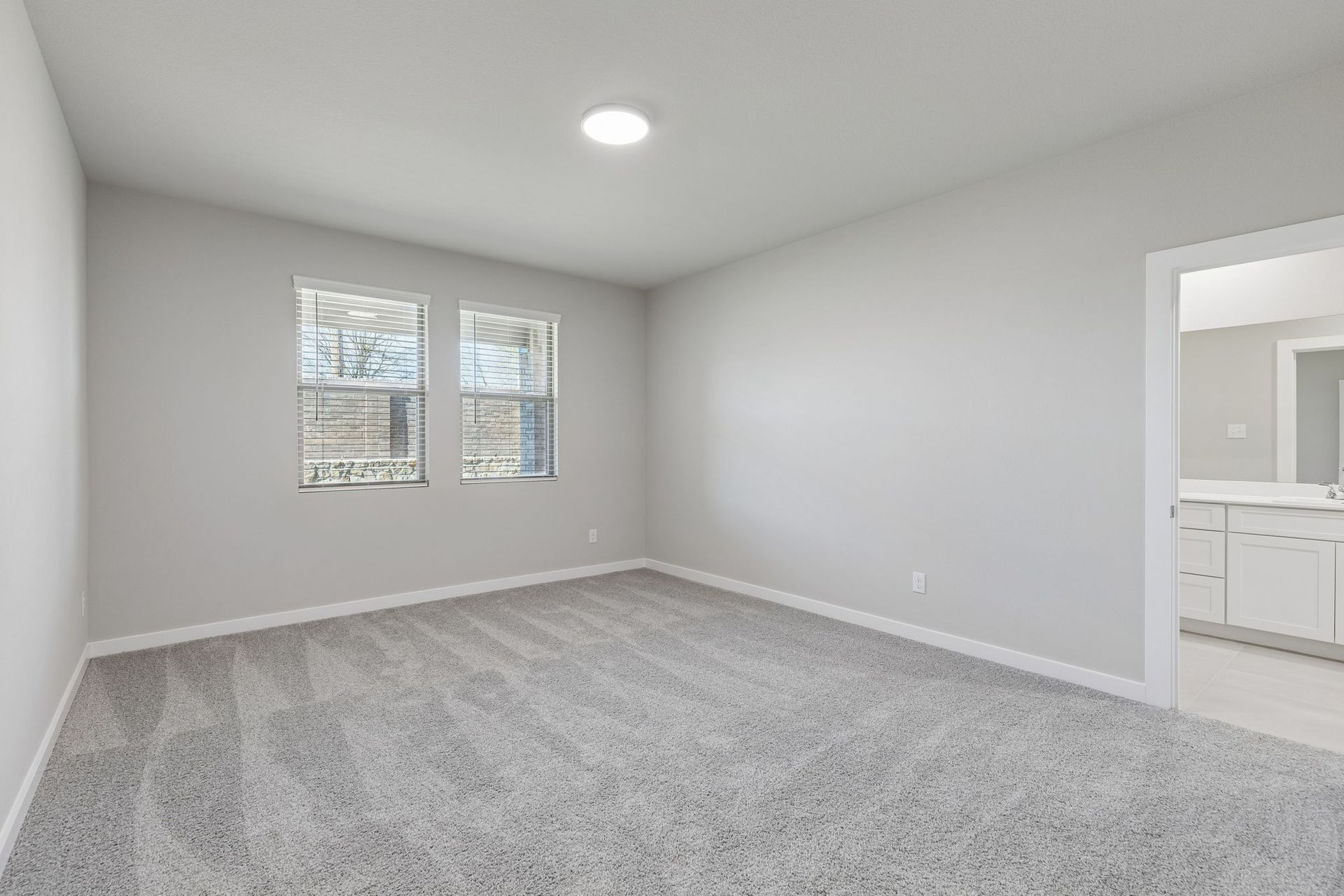 Primary Suite in the Holden home plan by Trophy Signature Homes – REPRESENTATIVE PHOTO