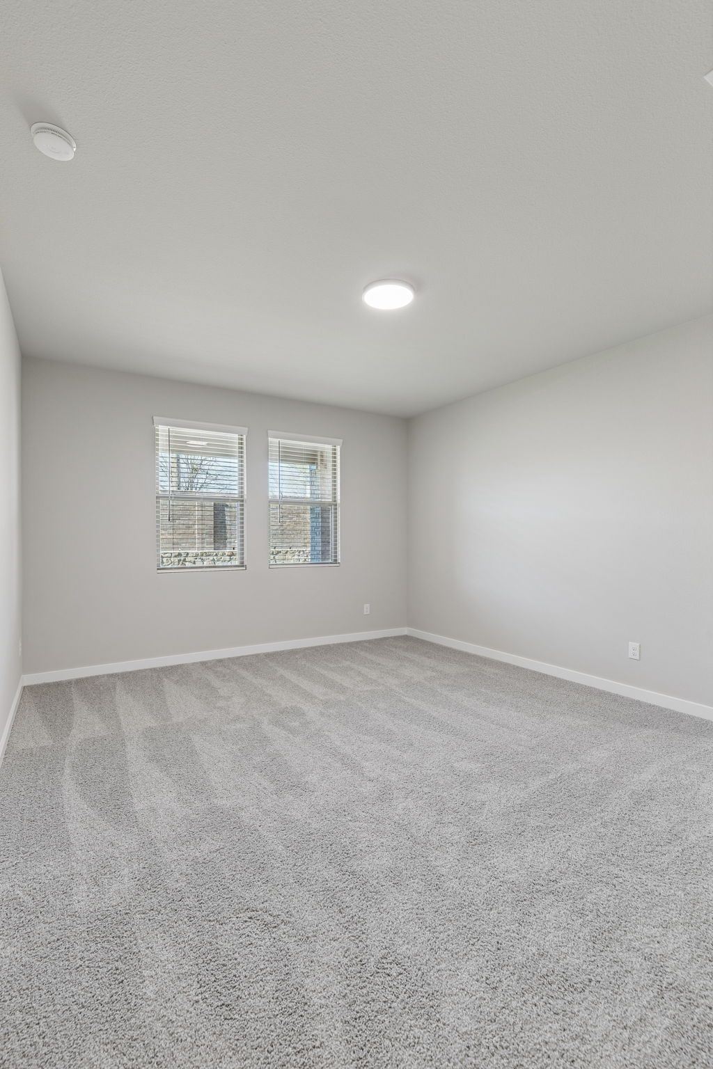 Primary Suite in the Holden home plan by Trophy Signature Homes – REPRESENTATIVE PHOTO