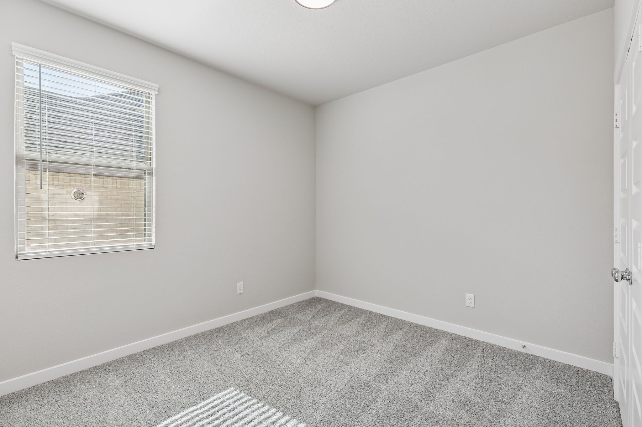 Bedroom in the Holden home plan by Trophy Signature Homes – REPRESENTATIVE PHOTO