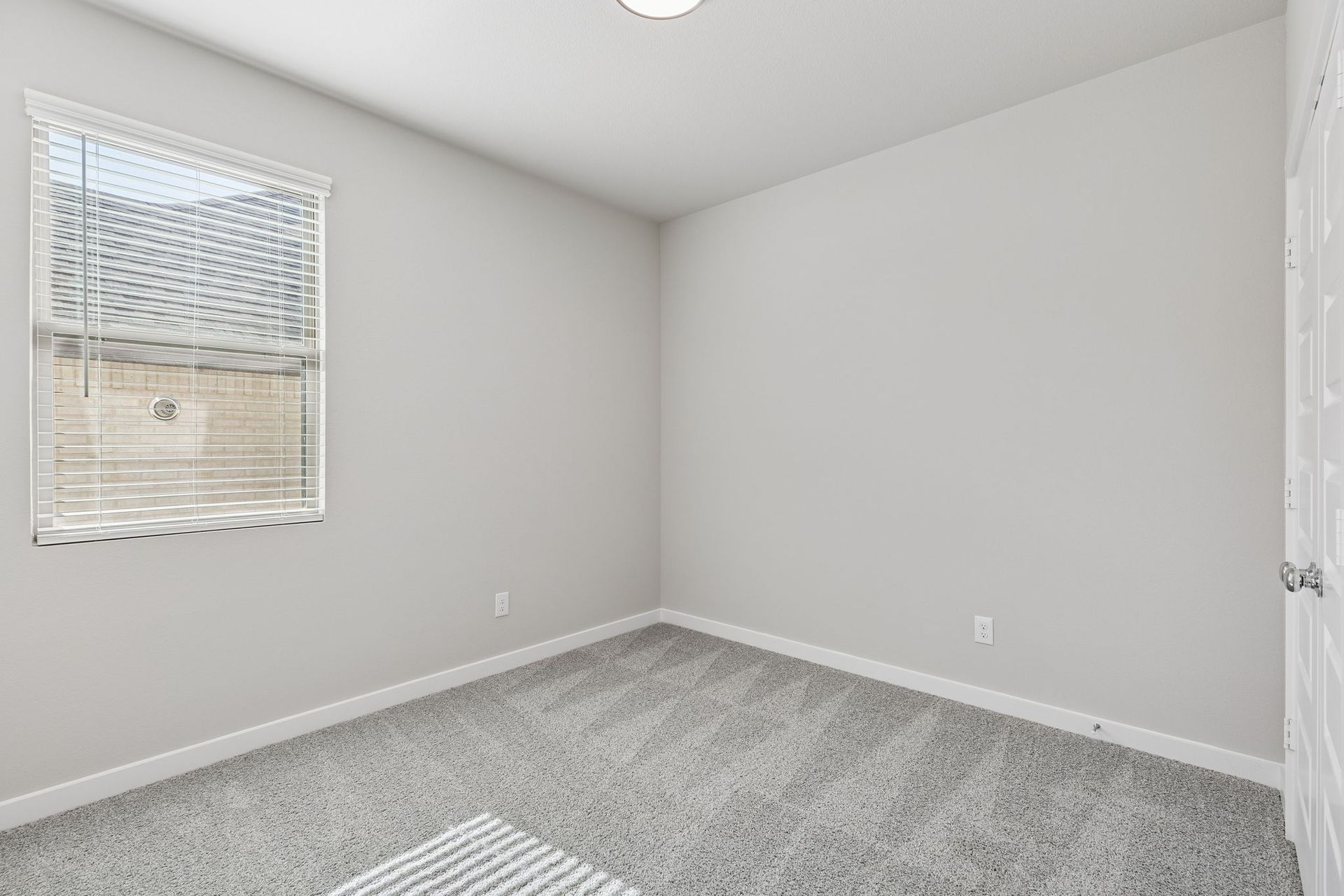 Bedroom in the Holden home plan by Trophy Signature Homes – REPRESENTATIVE PHOTO