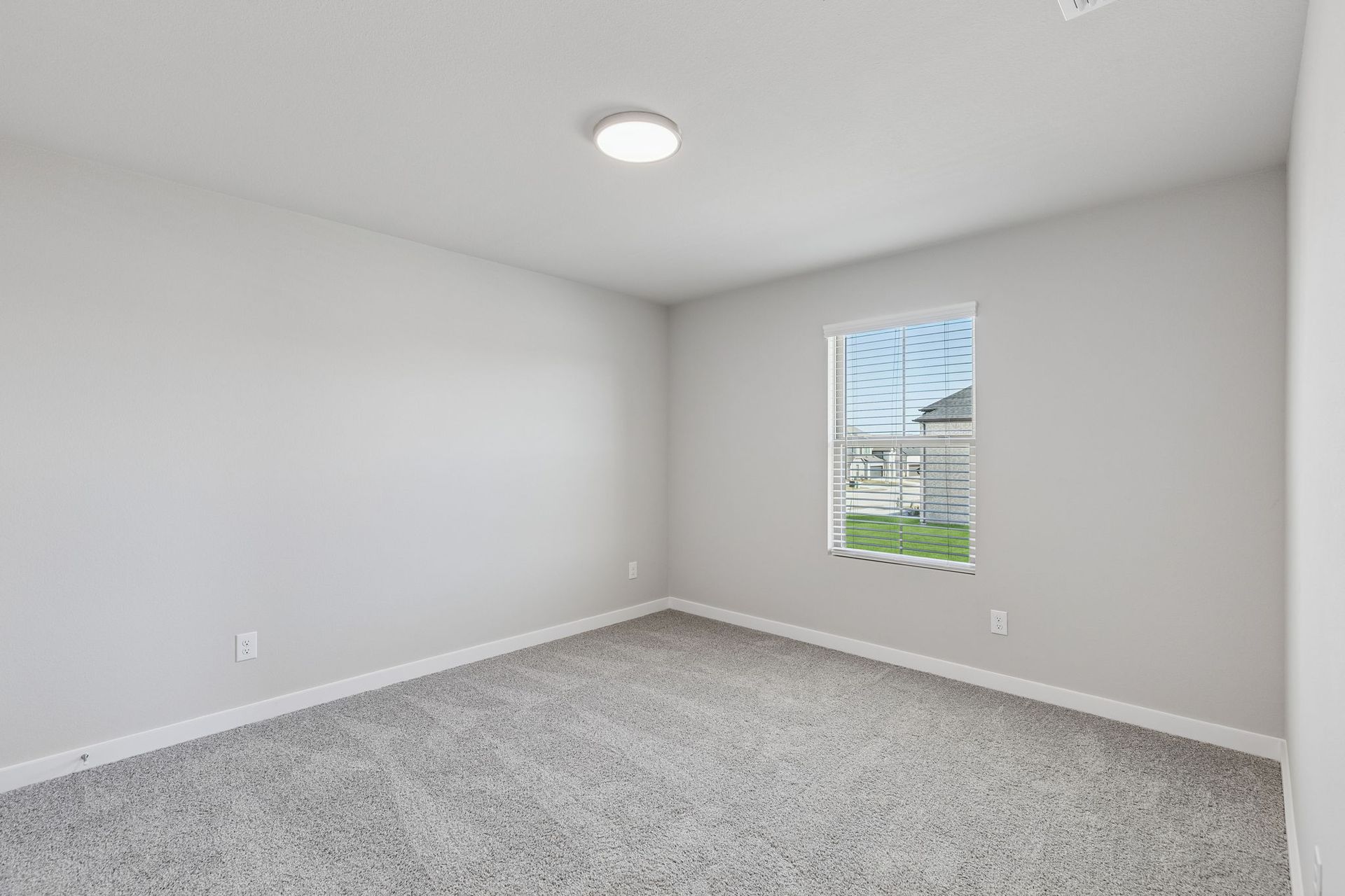 Bedroom in the Holden home plan by Trophy Signature Homes – REPRESENTATIVE PHOTO